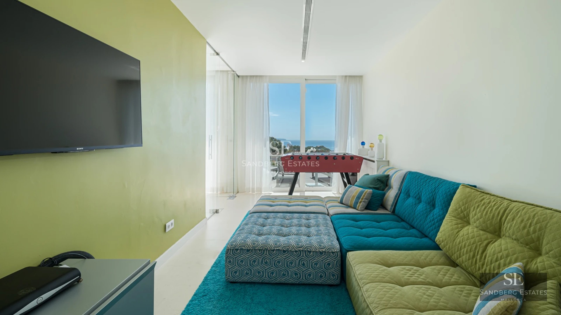 View of a modern villa with reflecting pool. Minimalist architecture, large windows and lush landscaping.