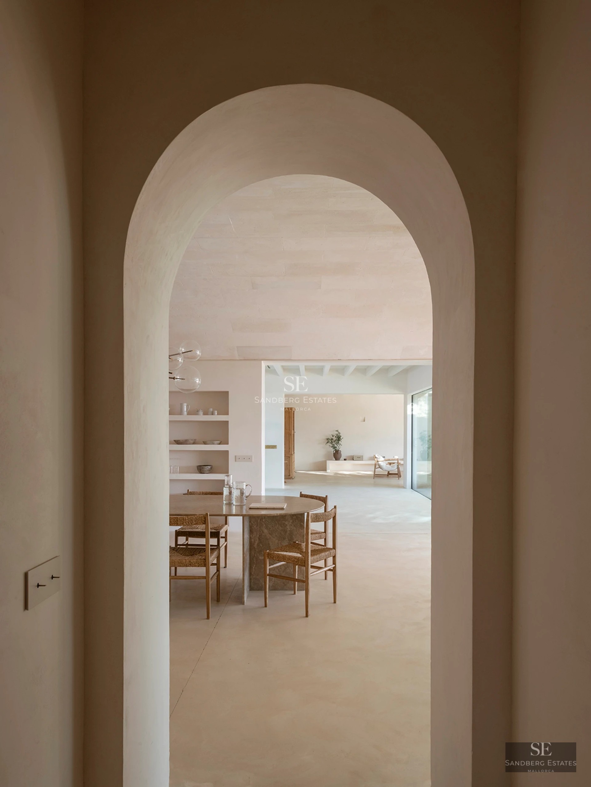 Exterior view of modern home with reflecting pool. Minimalist architecture, large windows, and manicured landscaping.