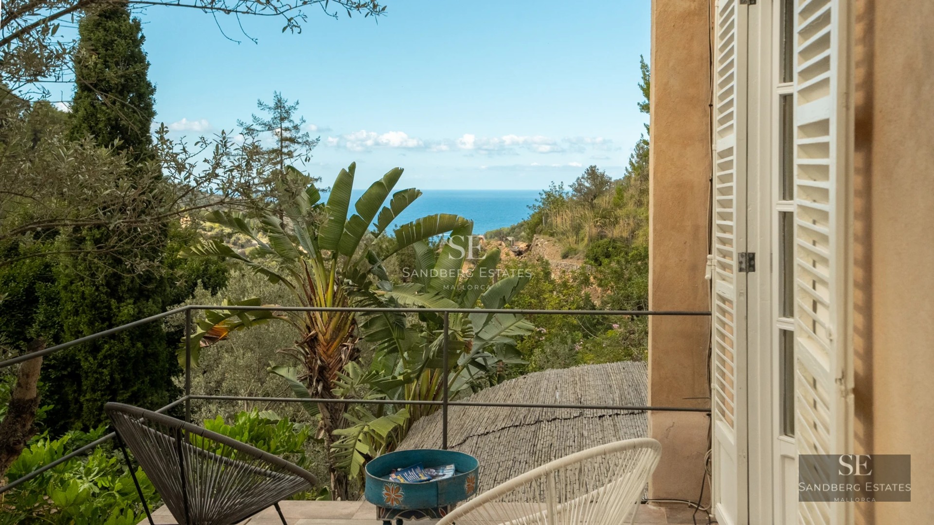 Modern penthouse featuring a spacious terrace, glass railing, and panoramic views. Minimalist design, natural lighting, and elegant furniture.