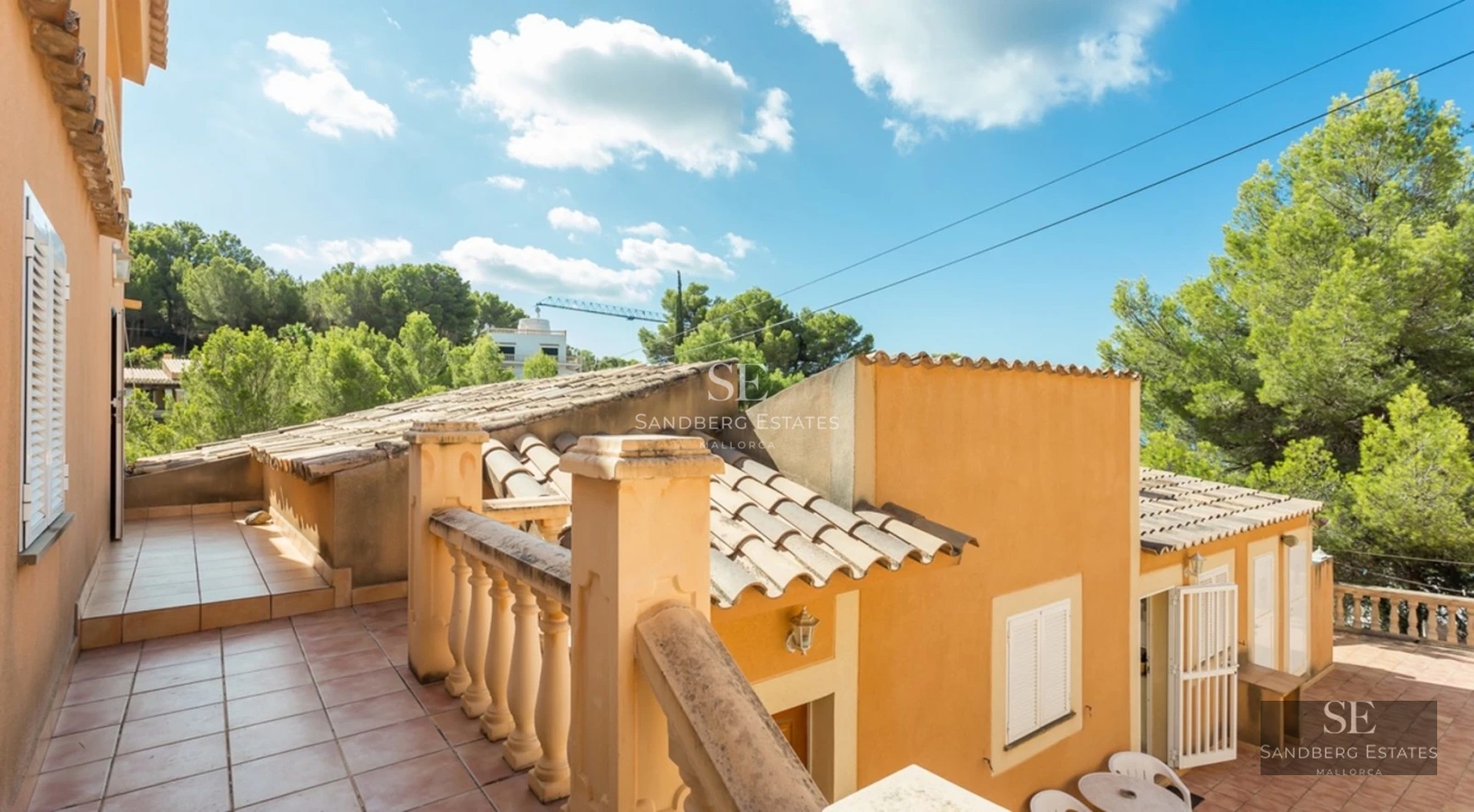 View of a luxurious villa with pool, landscaped garden, and modern architecture. Large windows and elegant design are highlighted.