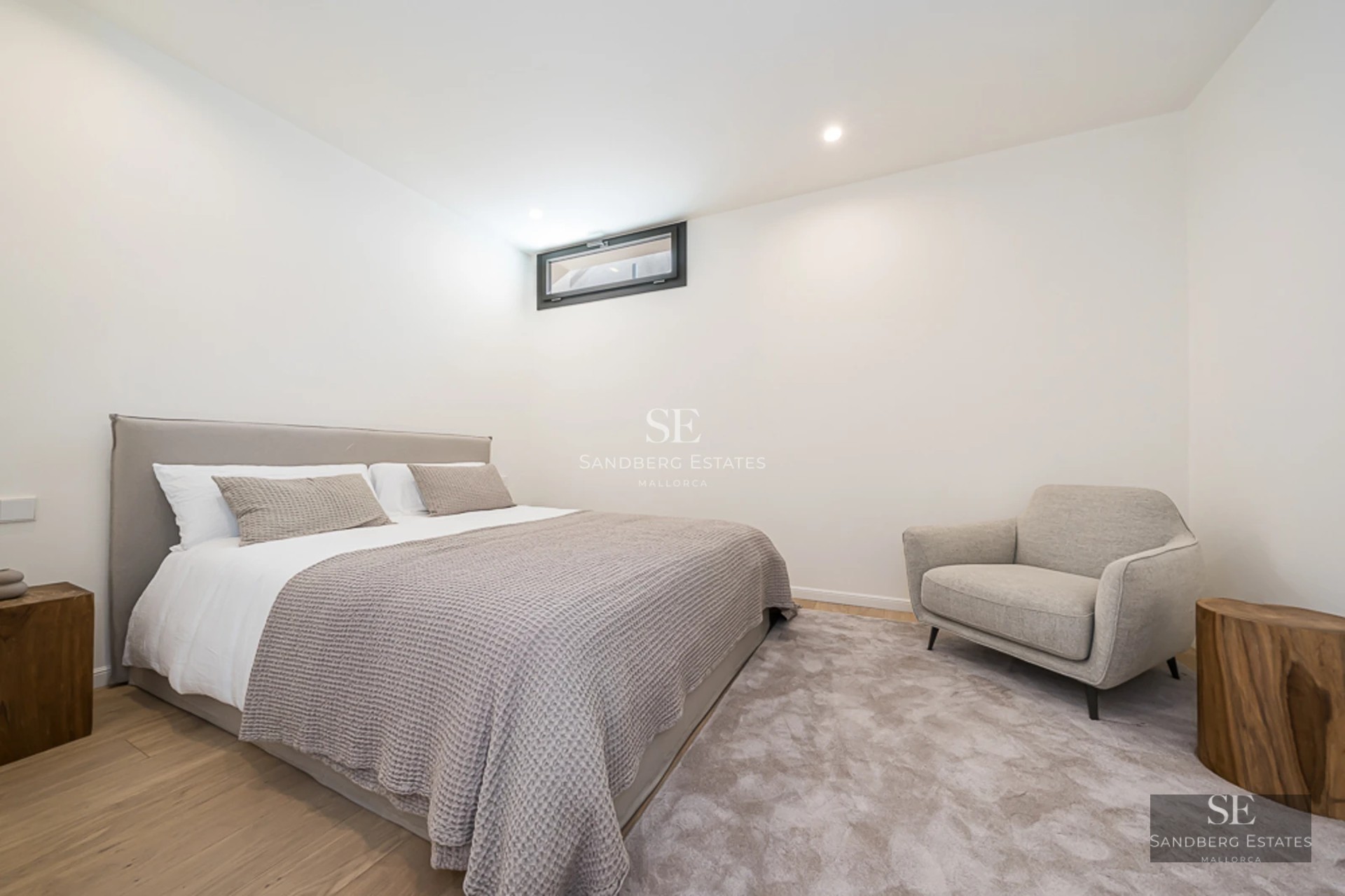 Spacious terrace featuring an infinity pool and sea views. Modern architecture with elegant furniture and lush vegetation.