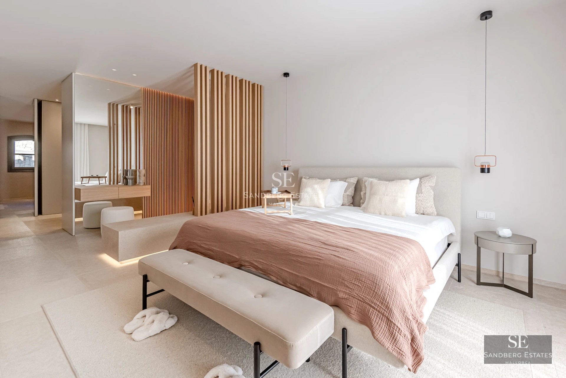 Exterior view of a modern luxury home with infinity pool, wooden deck, and large glass windows. Contemporary design and manicured landscaping.