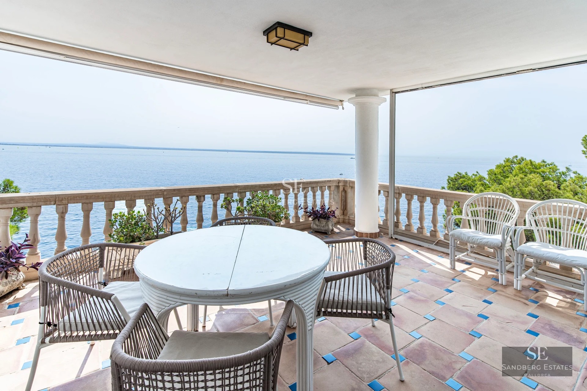 Exterior view of a modern villa with swimming pool, garden, and terrace. Minimalist design with large windows and natural light.