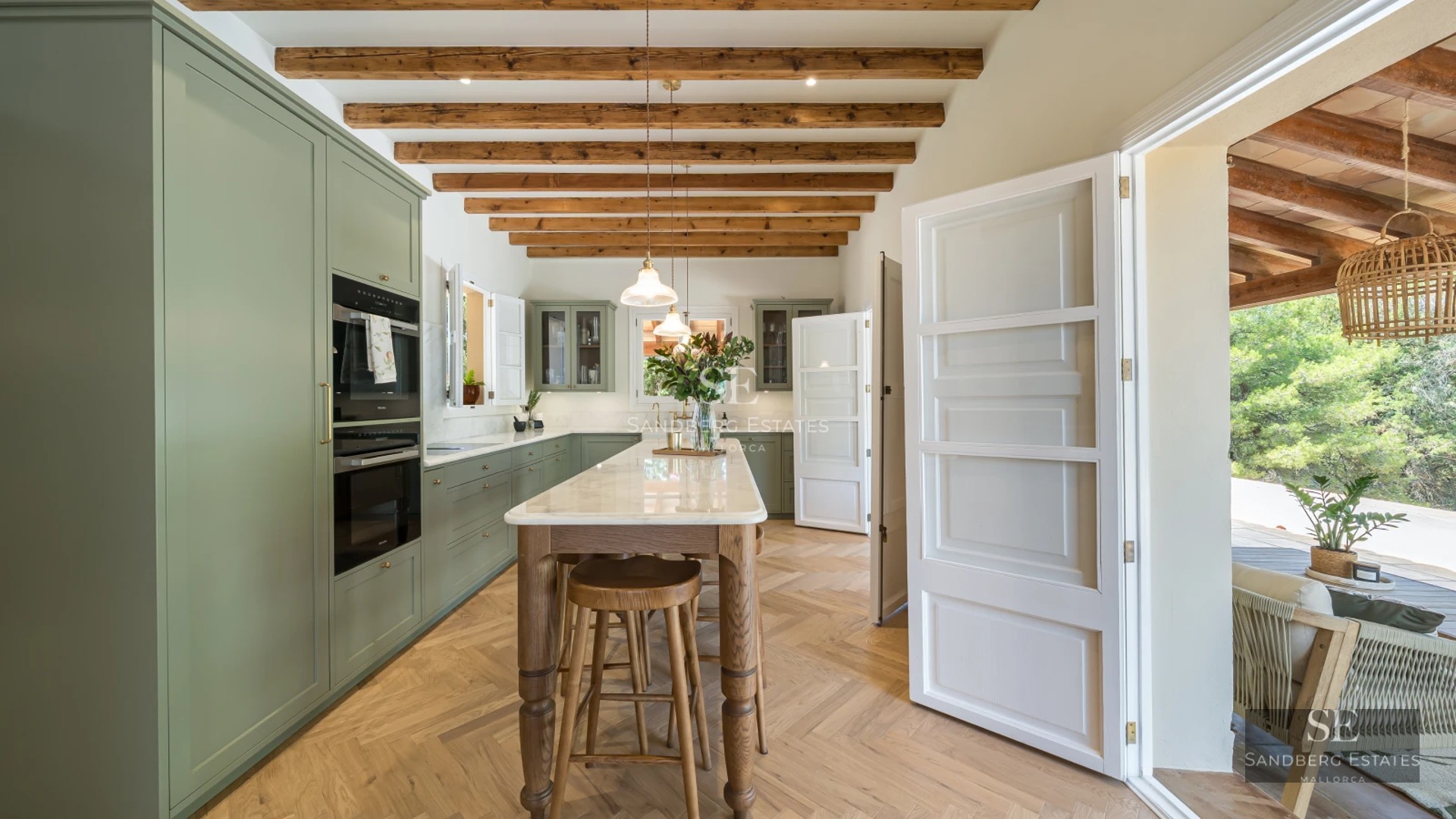 Panoramic view from a balcony with infinity pool and sea views. Modern, minimalist design, with glass railing.