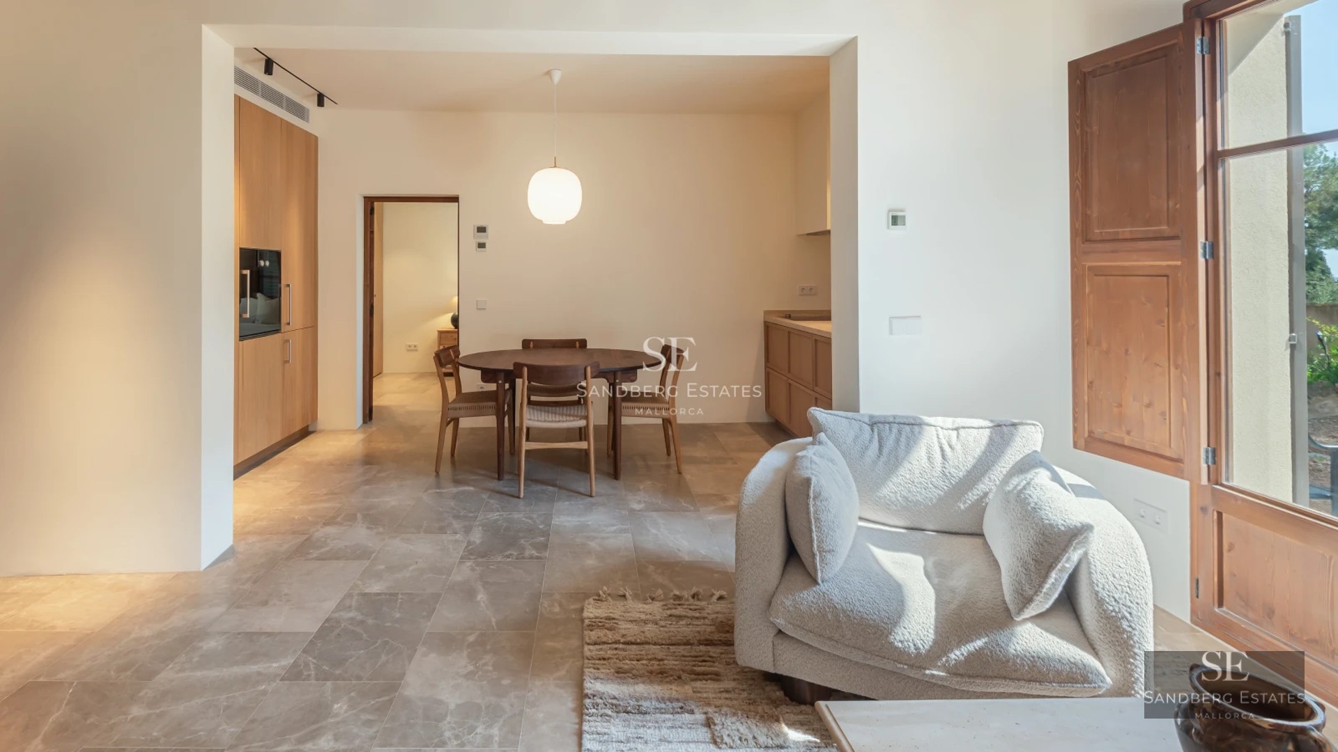 Pool view with lounge chairs and lush garden. Elegant modern design. Natural lighting highlighting the vegetation.