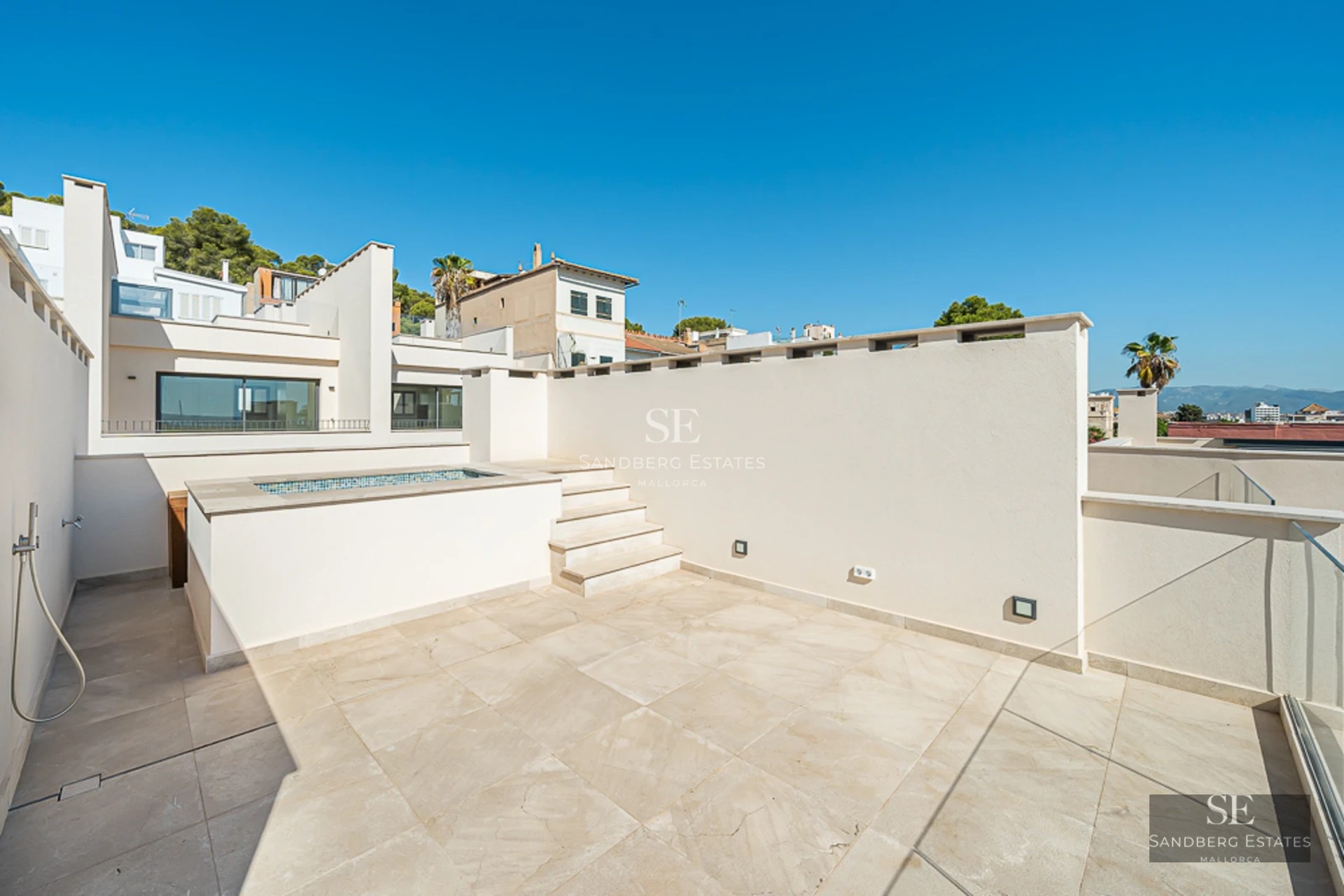 Luxurious exterior with shimmering pool, stylish sun loungers, and lush greenery. Modern architecture and unobstructed views.