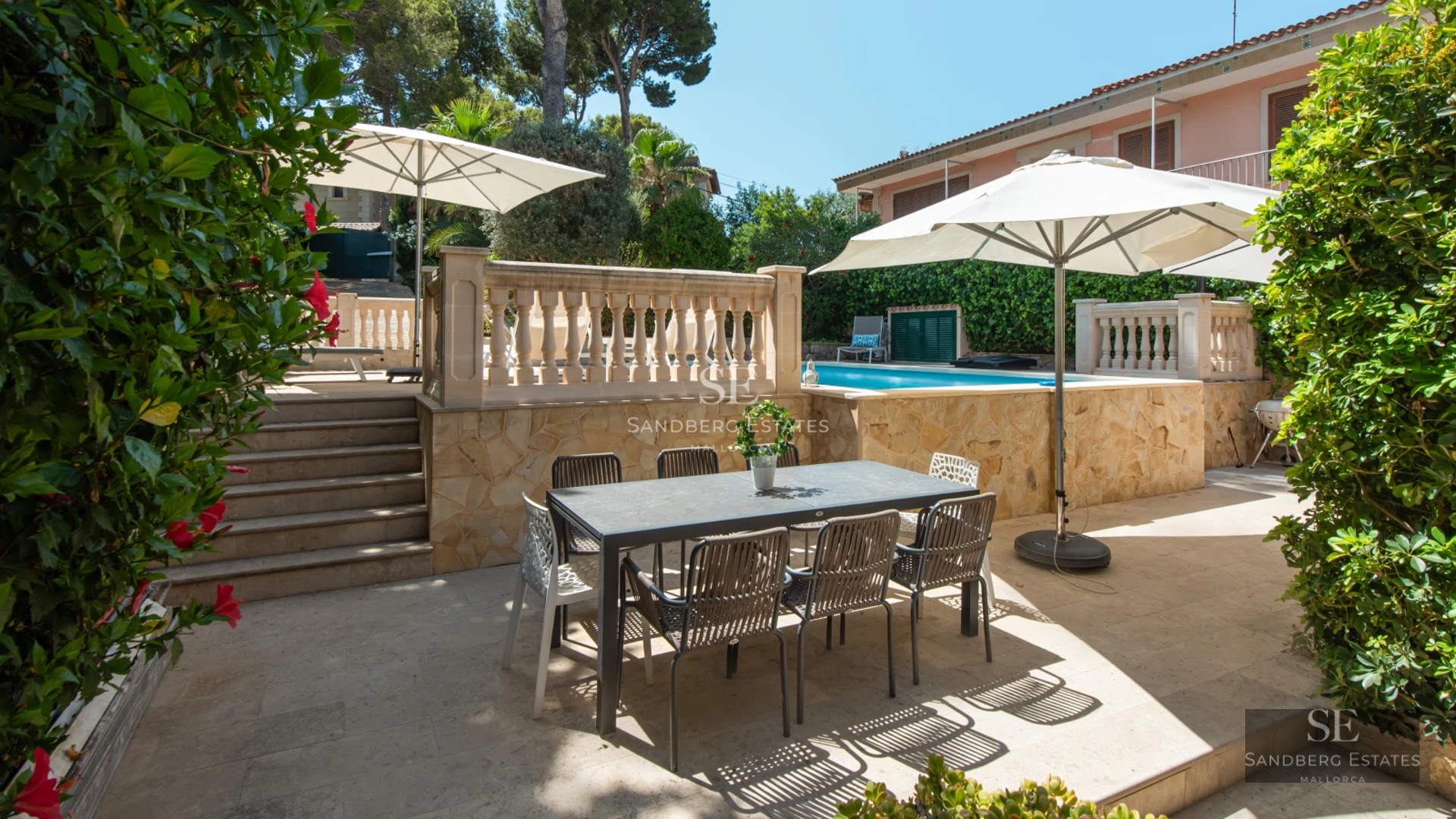 Modern exterior featuring an infinity pool, sun loungers, and panoramic views. Minimalist architecture and landscaped garden.