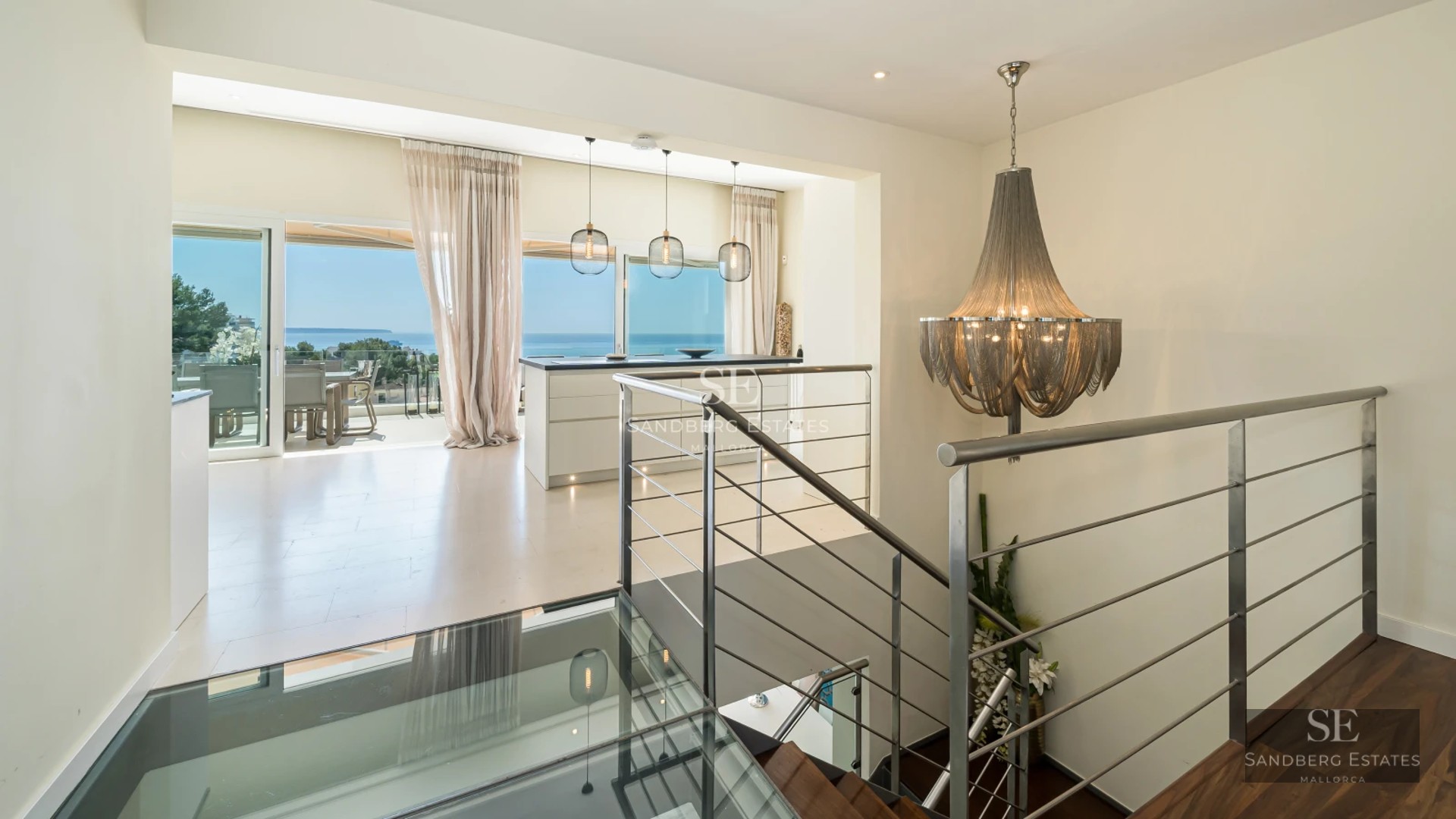 Garden view featuring a pool, terrace, and lush vegetation. Modern design with large windows and high-quality finishes.