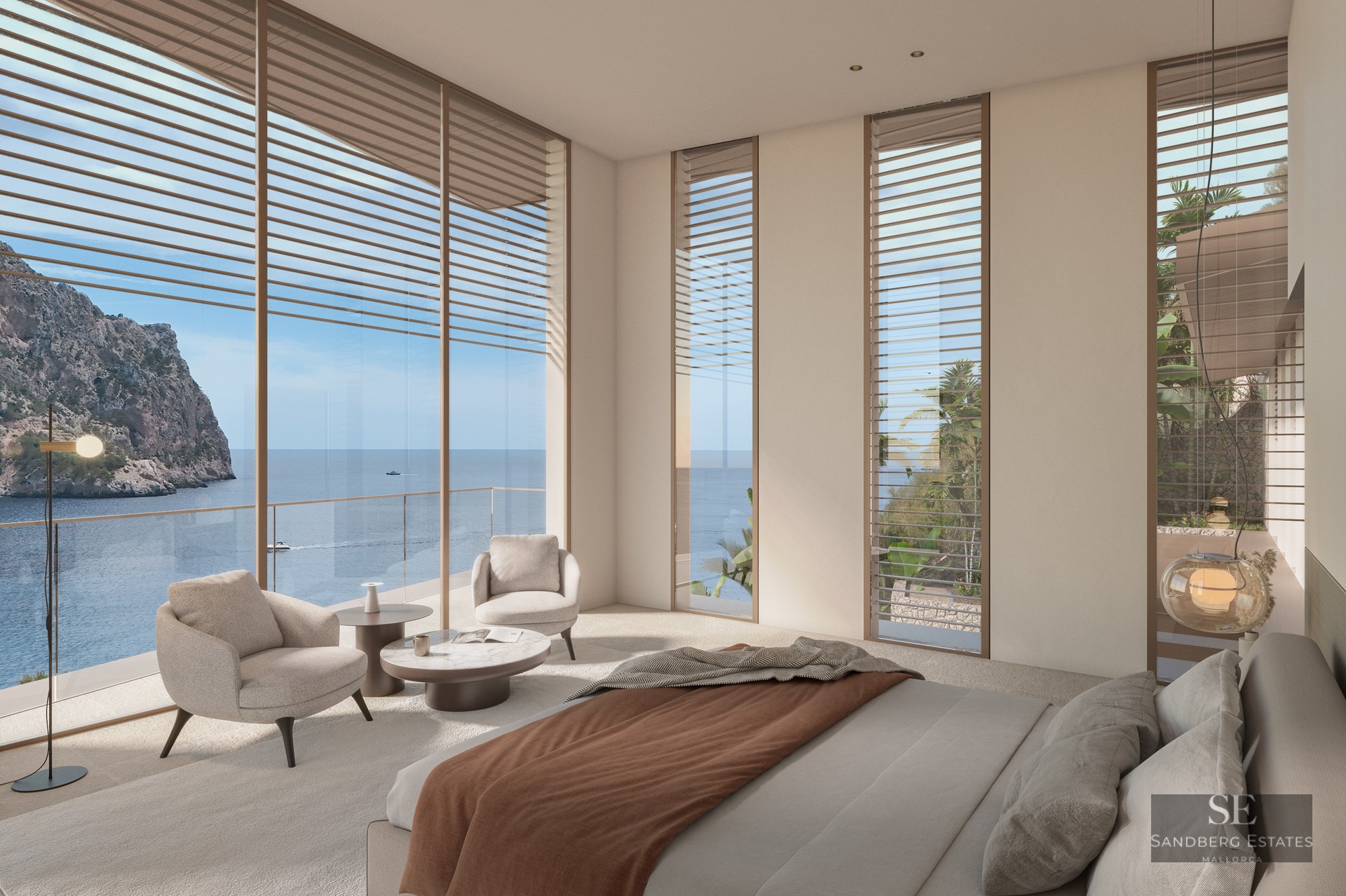 Modern bedroom with floor-to-ceiling windows overlooking the ocean and cliffs, beige armchairs, and minimalist decor.