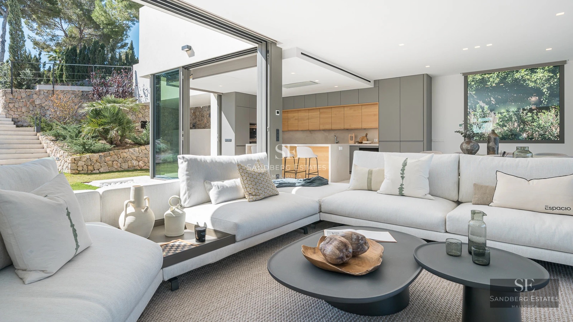 Exterior view of a modern villa featuring a pool, lush garden, and large windows. Minimalist architectural design.