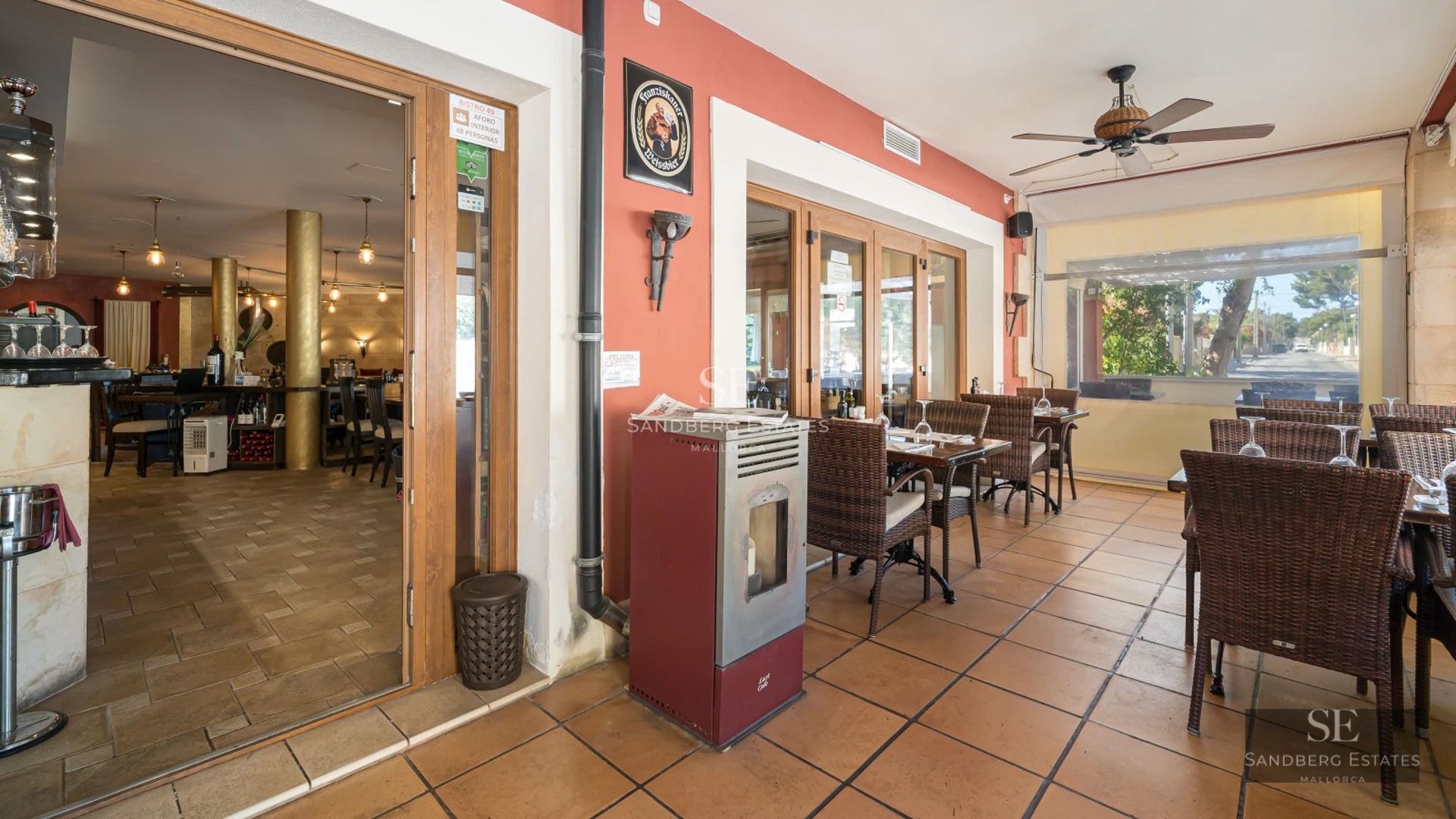Aerial view of a modern villa with a reflective pool, surrounded by lush gardens. Minimalist architecture with large windows.