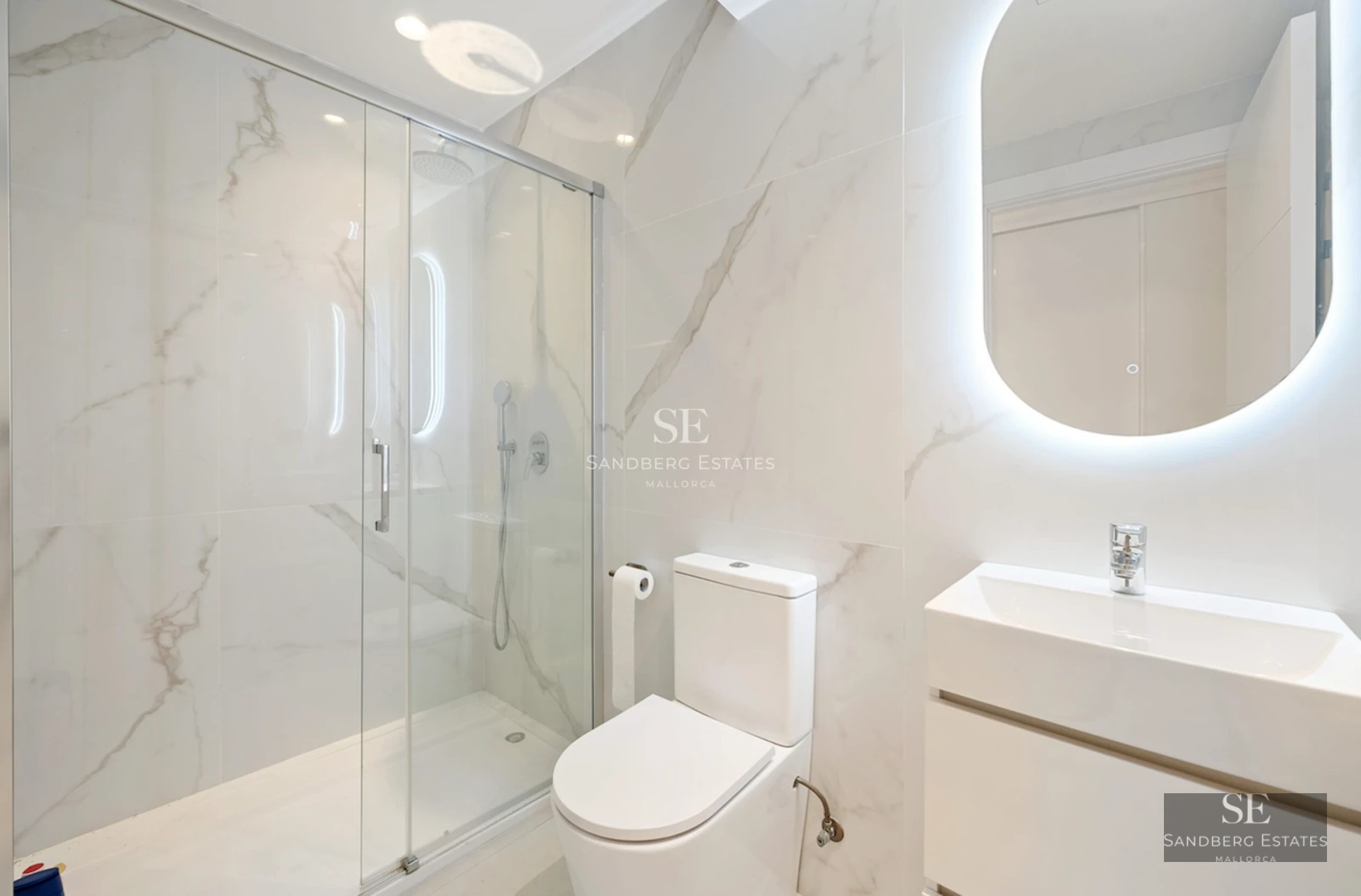 Spacious balcony with sea views. Modern furniture, glass railing. Perfect for relaxing and enjoying the sunset.