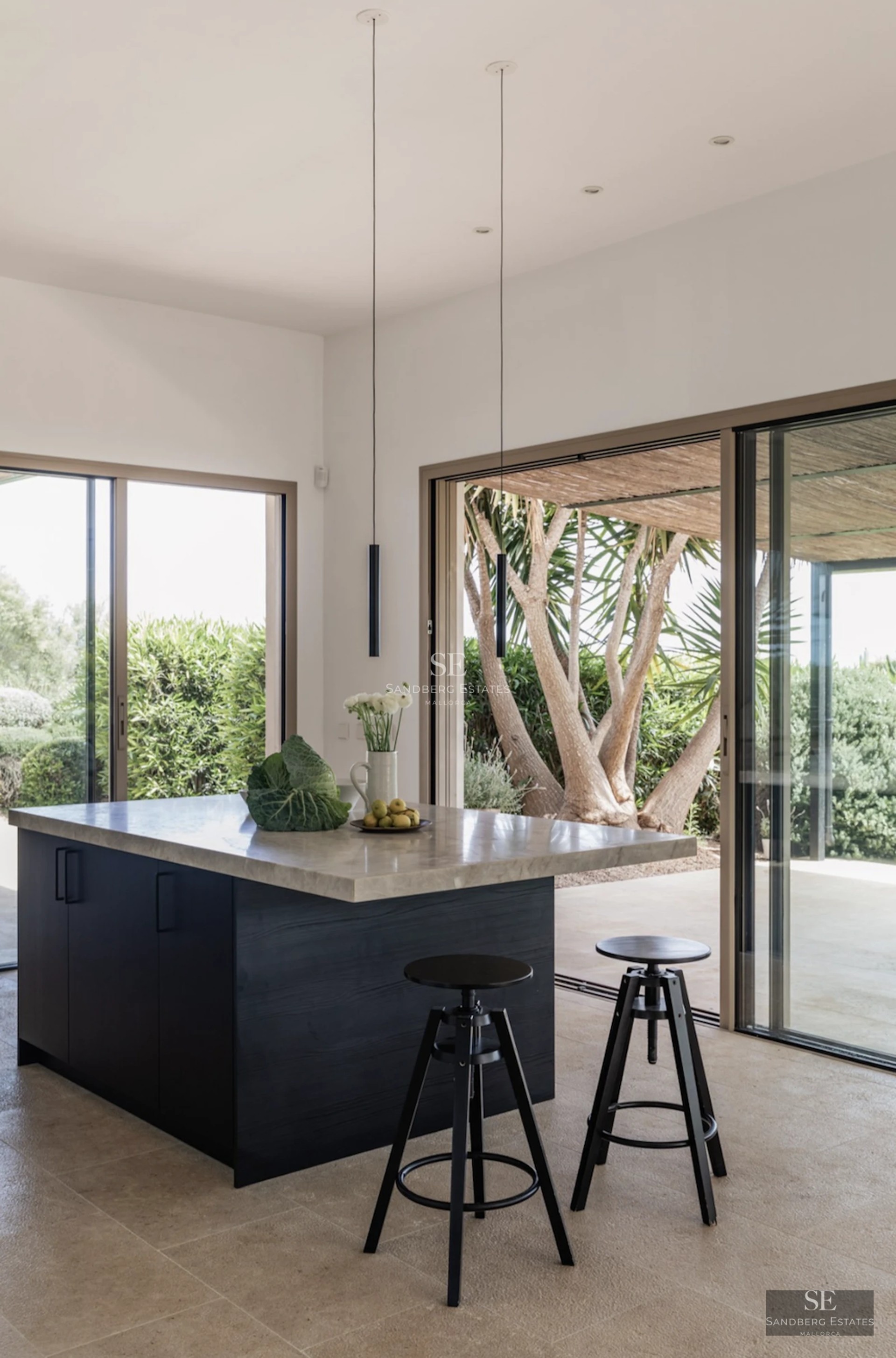 Spacious living room with sea view windows. Modern design with elegant furniture and wooden floors. Abundant natural light.