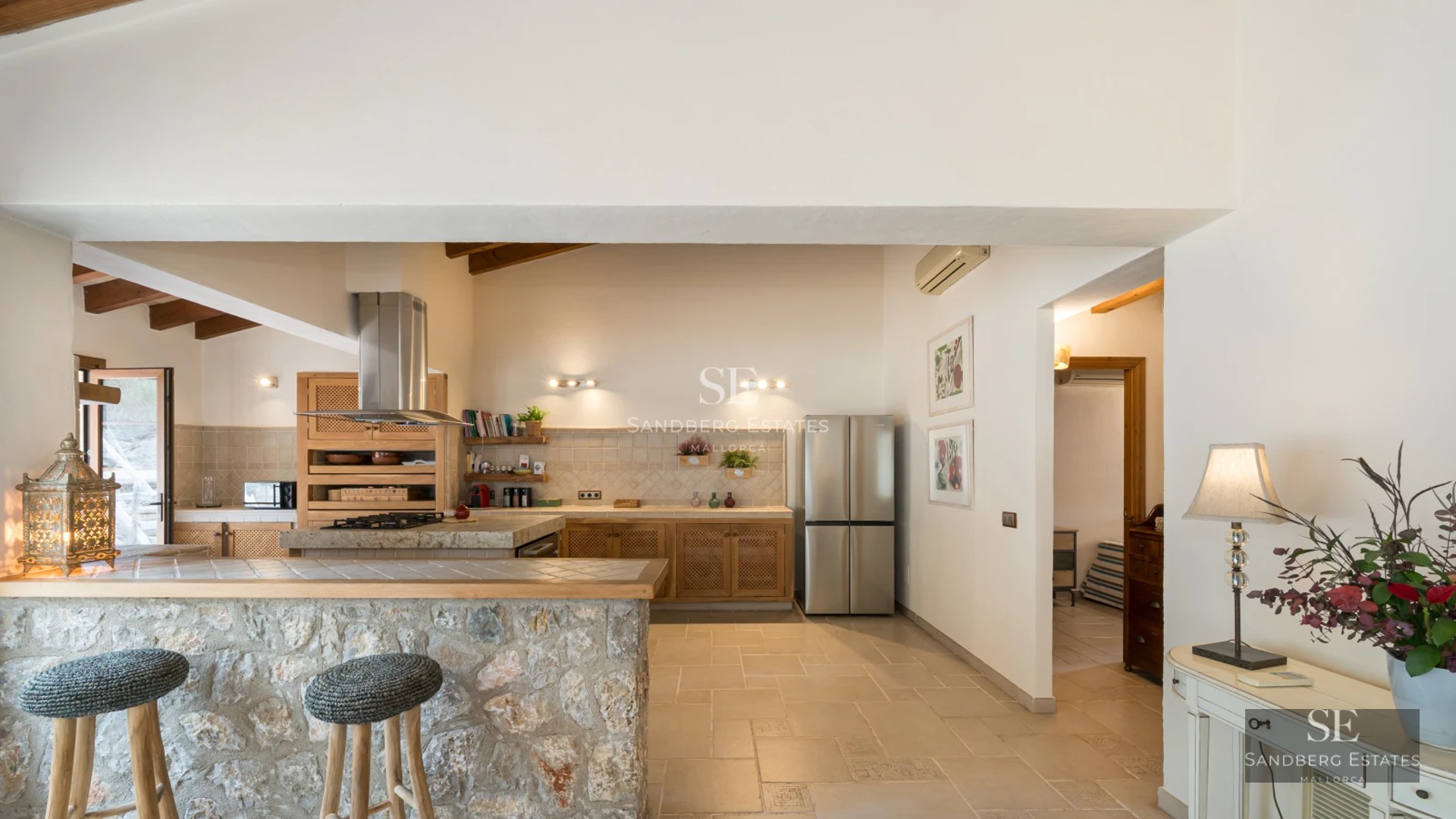 Exterior view of a modern villa featuring an infinity pool, lush garden, and minimalist architecture. Large windows and sunny terraces.