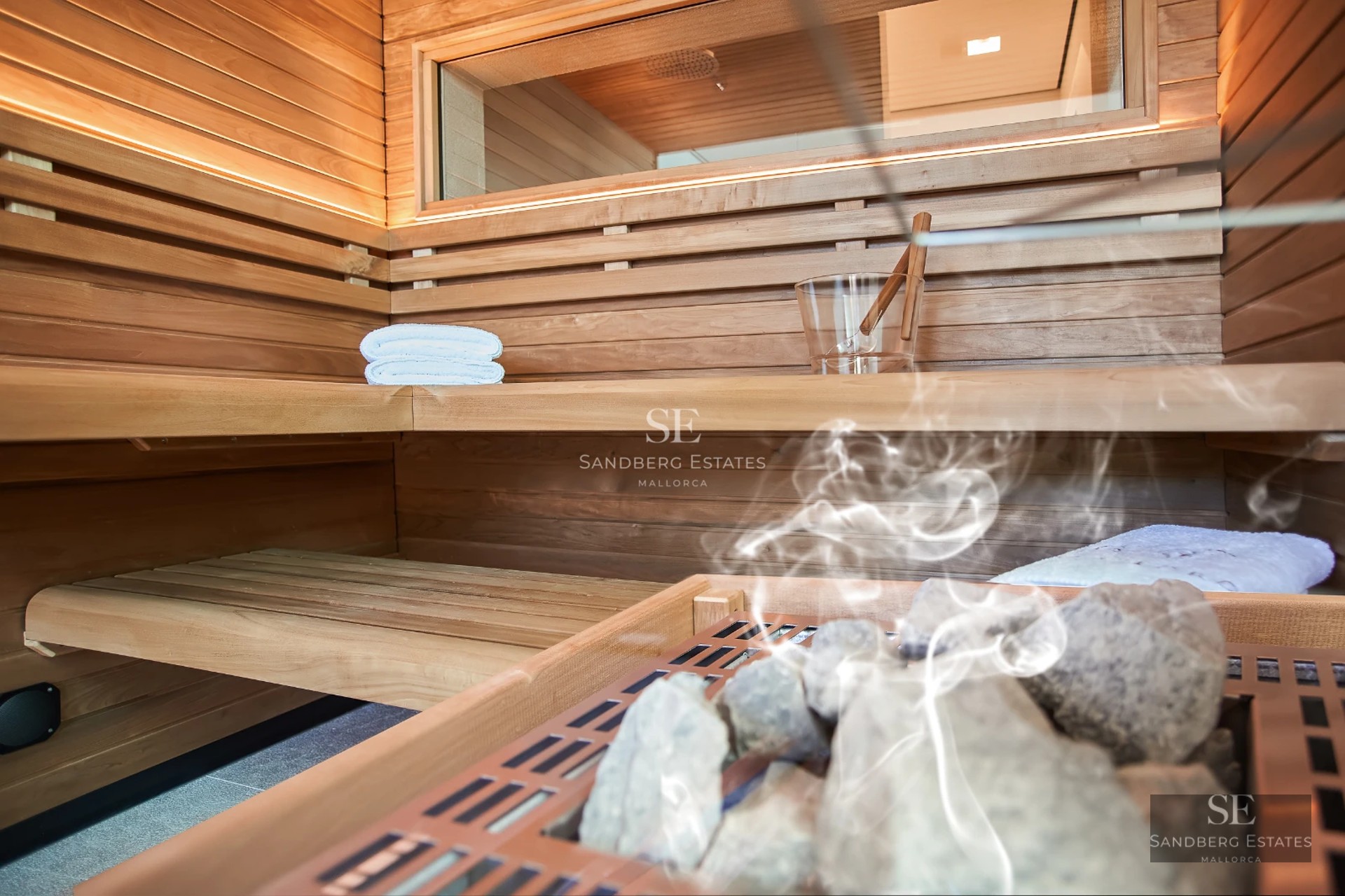 Exterior view of a modern villa with a pool, large windows, terrace, and garden. Minimalist design with high-quality finishes.