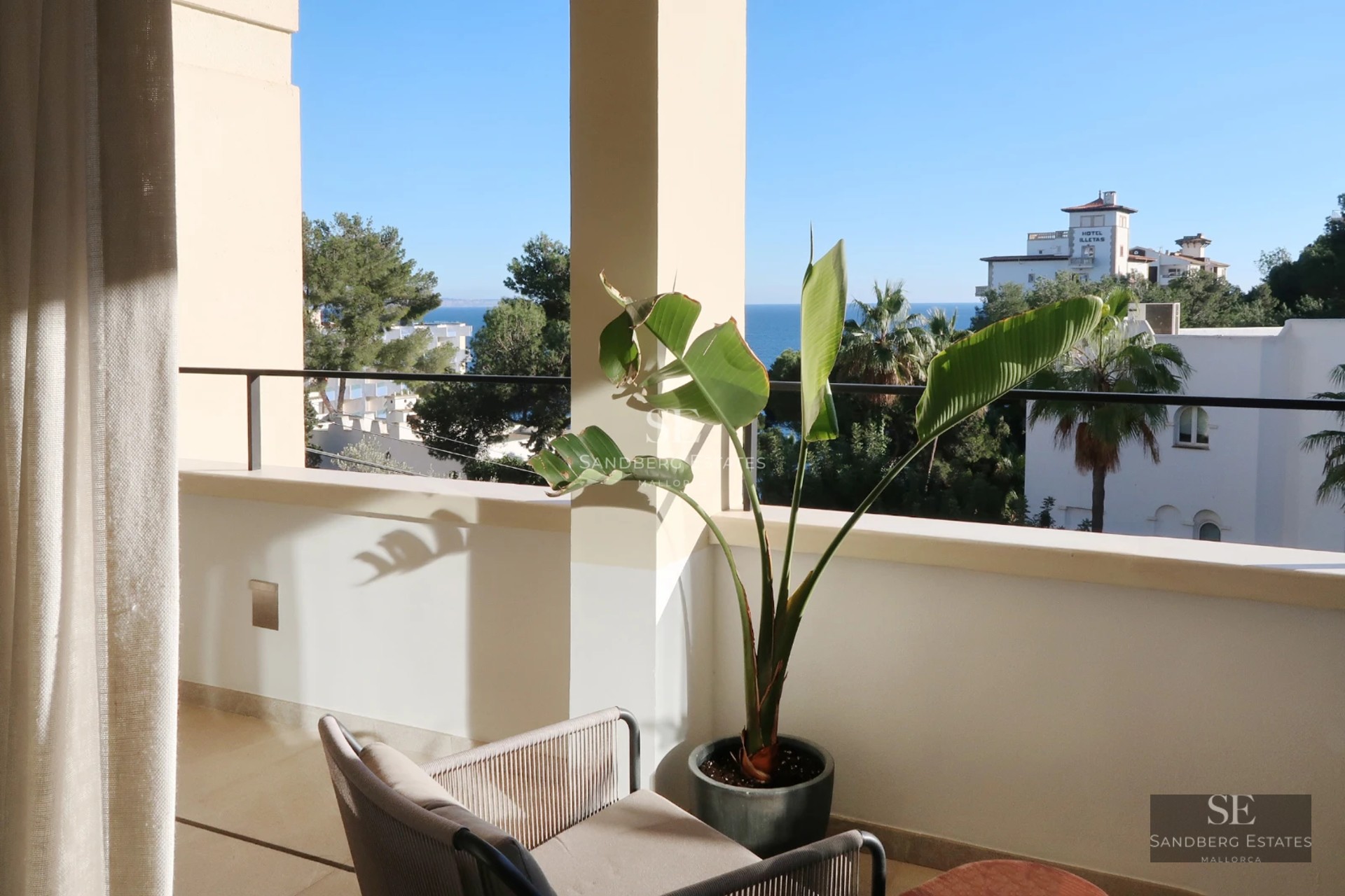 View of a modern villa with a pool, large windows, and lush greenery. Minimalist design with luxury touches.