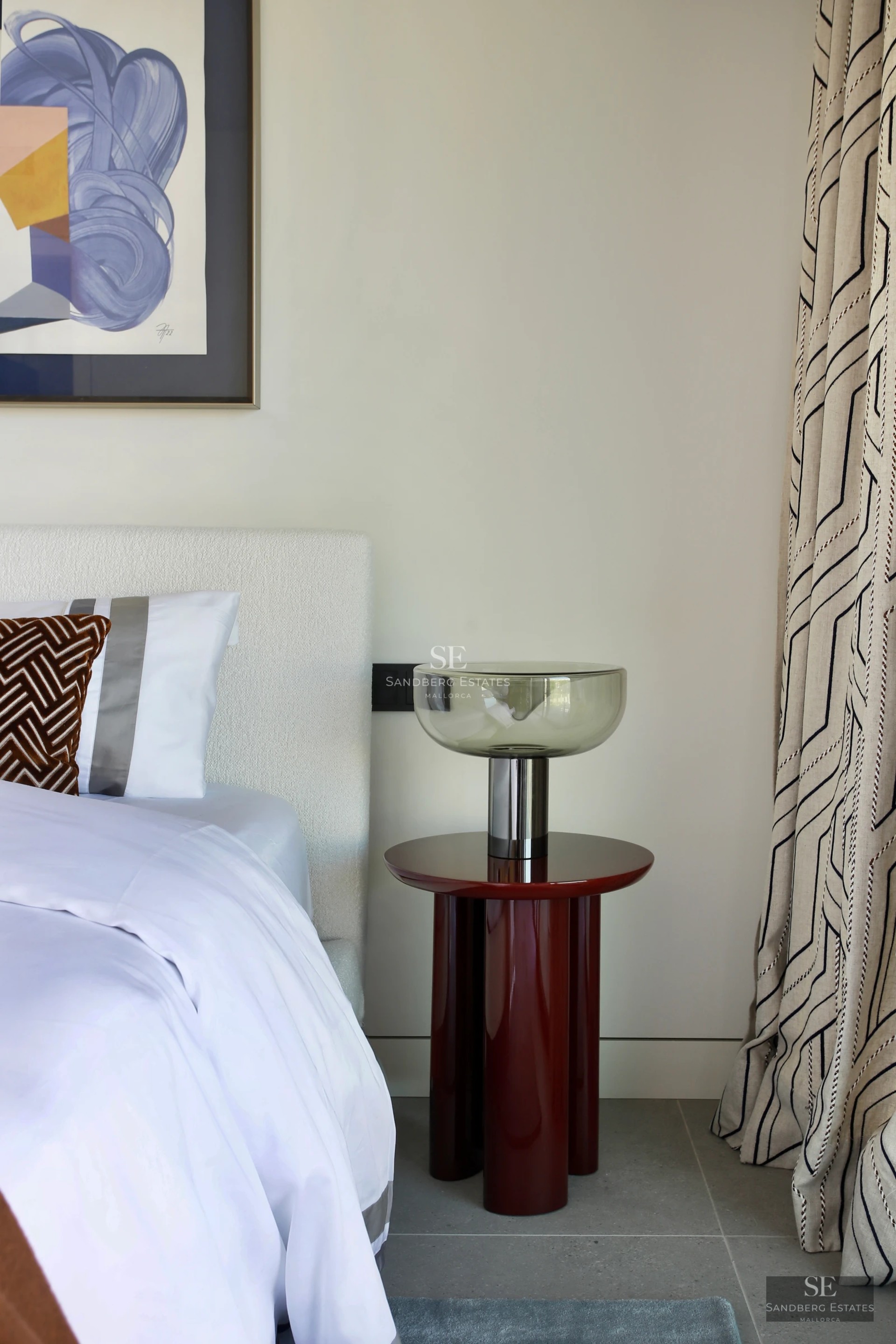 Spacious living room with panoramic windows, balcony with panoramic view, light wood floors, and modern designer furniture. Bright and elegant.