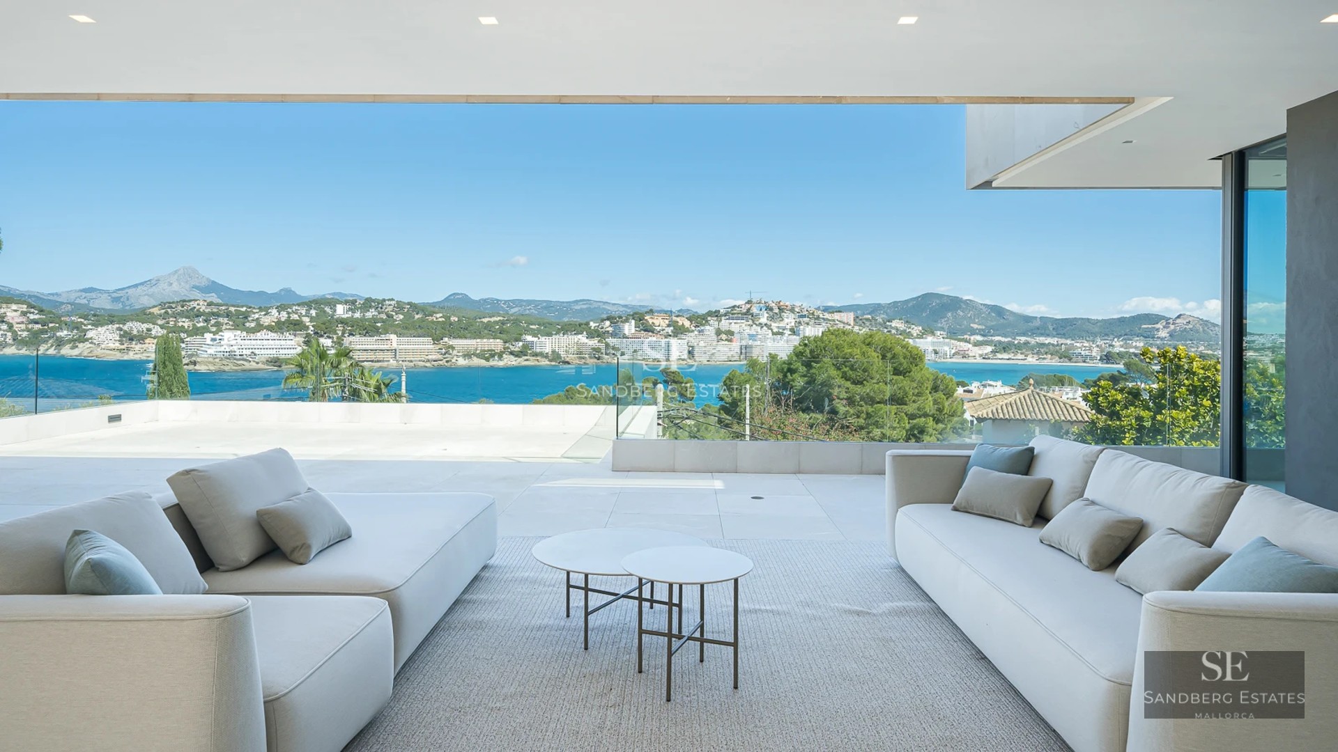 Exterior view of a modern villa featuring a pool, lush garden, and minimalist architecture. Natural lighting and high-quality finishes.