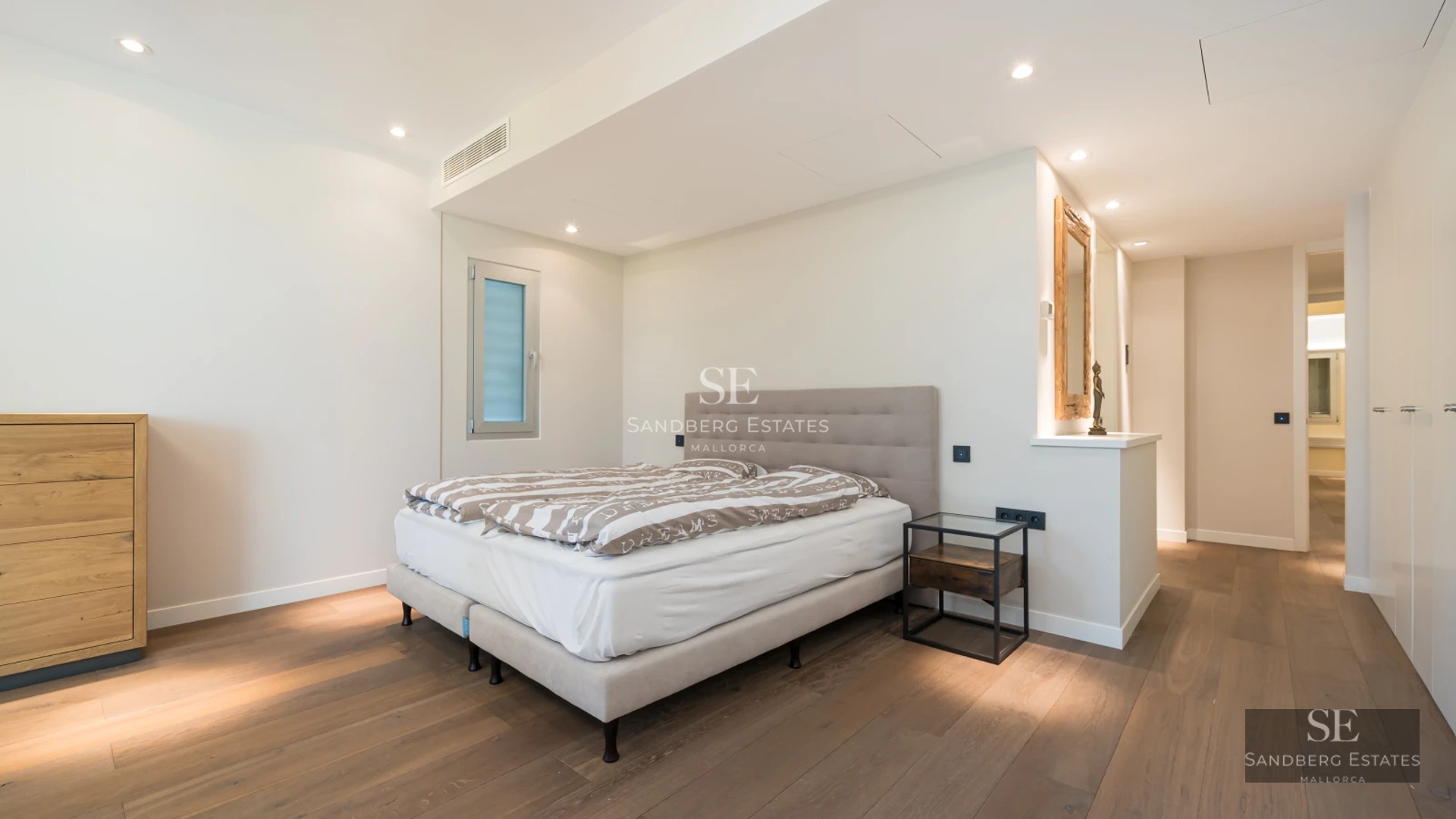 Spacious terrace with pool and sea view. Modern design, elegant furniture, and neutral color palette. Abundant natural lighting.