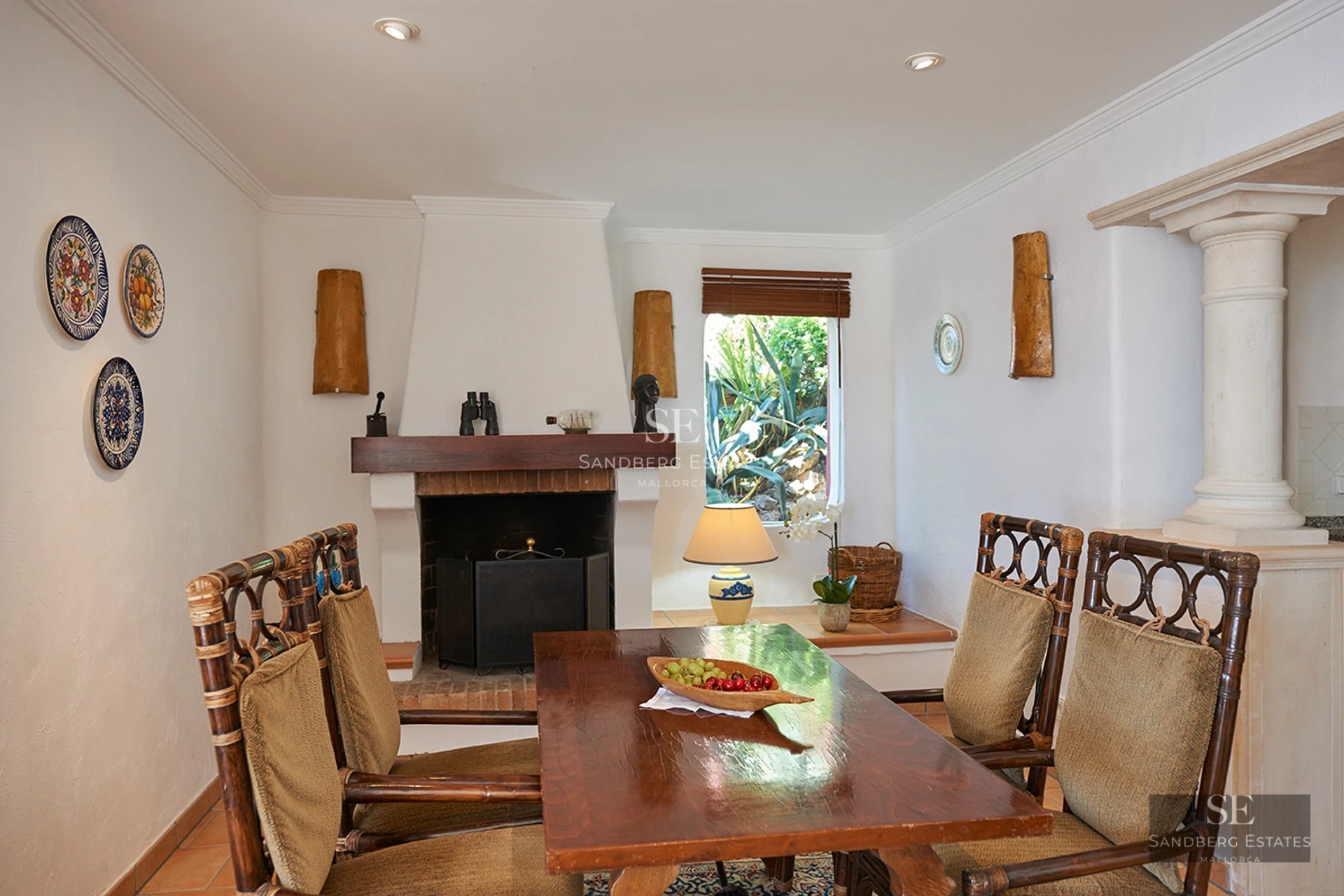 View of infinity pool and terrace. Modern architecture with clean lines. Palm trees and blue sky in the background.