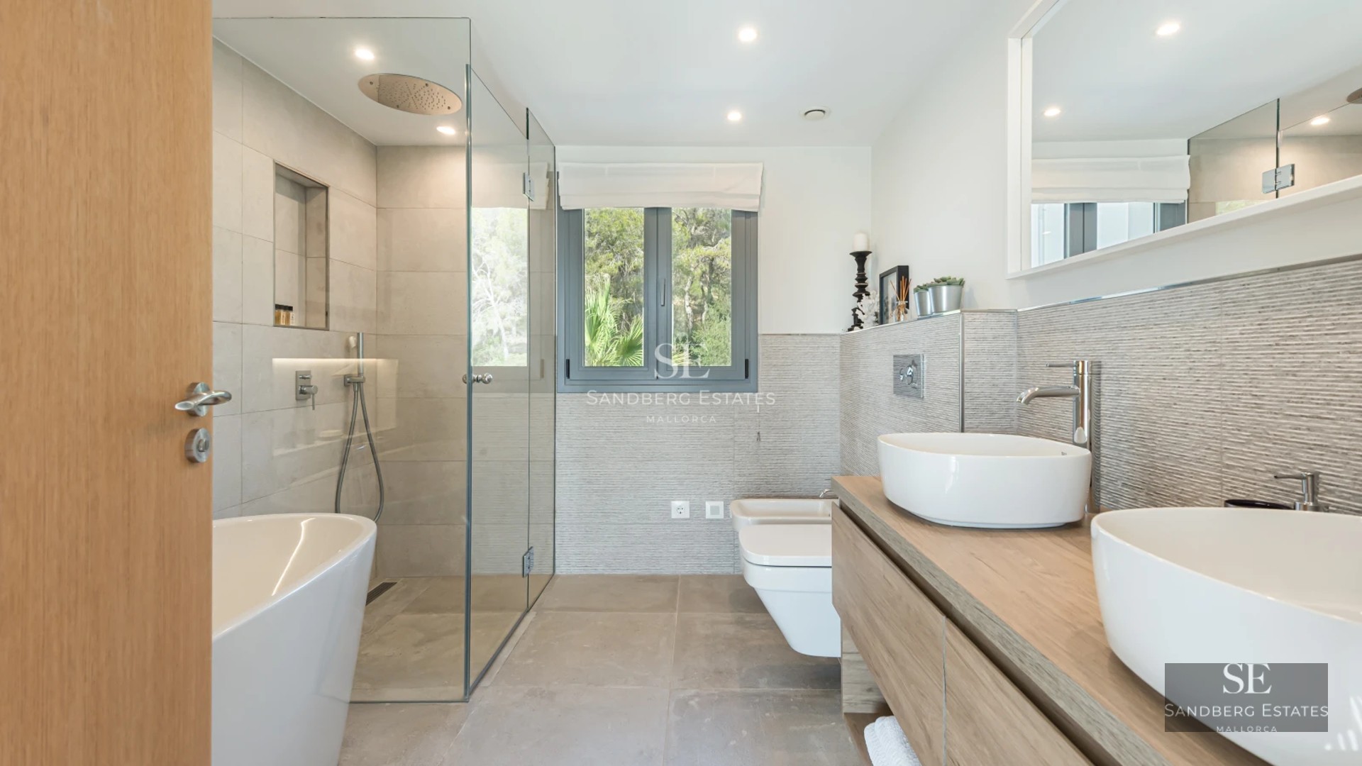 Aerial view of a modern villa featuring a swimming pool, lush garden, and minimalist architecture. Luxury and design at its finest.