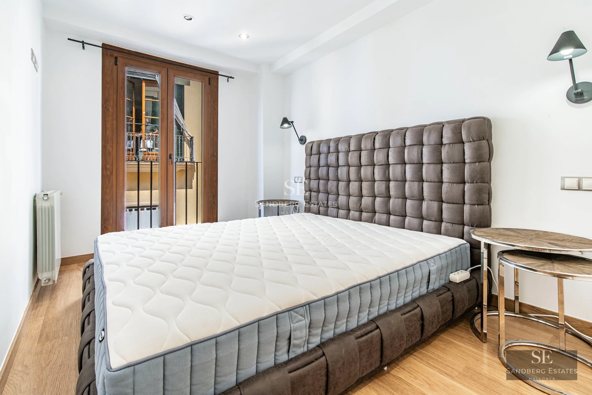 Panoramic view of a modern pool with loungers, umbrellas, and lush tropical greenery. Elegant exterior design.