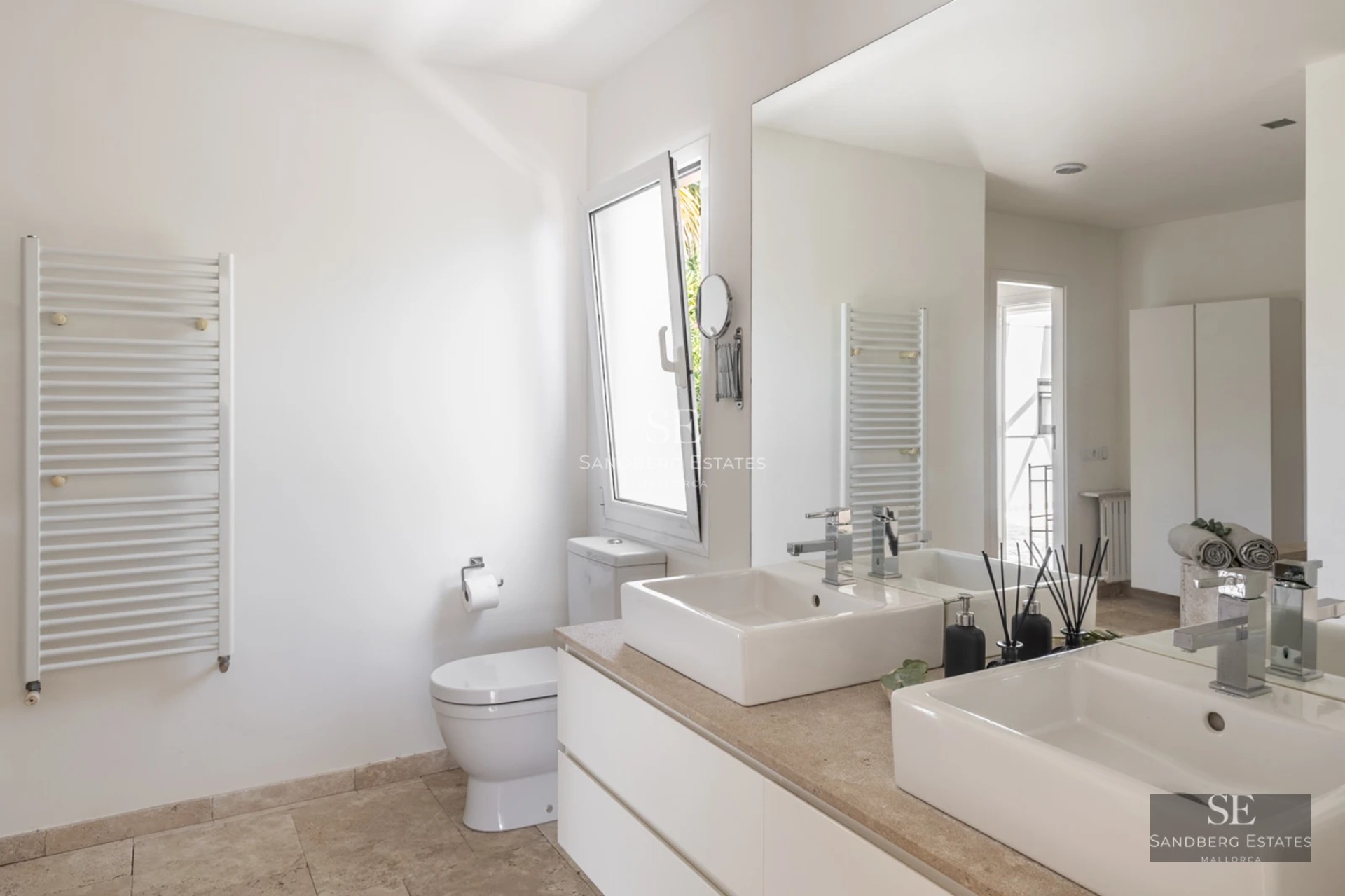 Spacious living room with large windows, panoramic sea views, and balcony access. Modern design, natural light, and high-quality finishes.