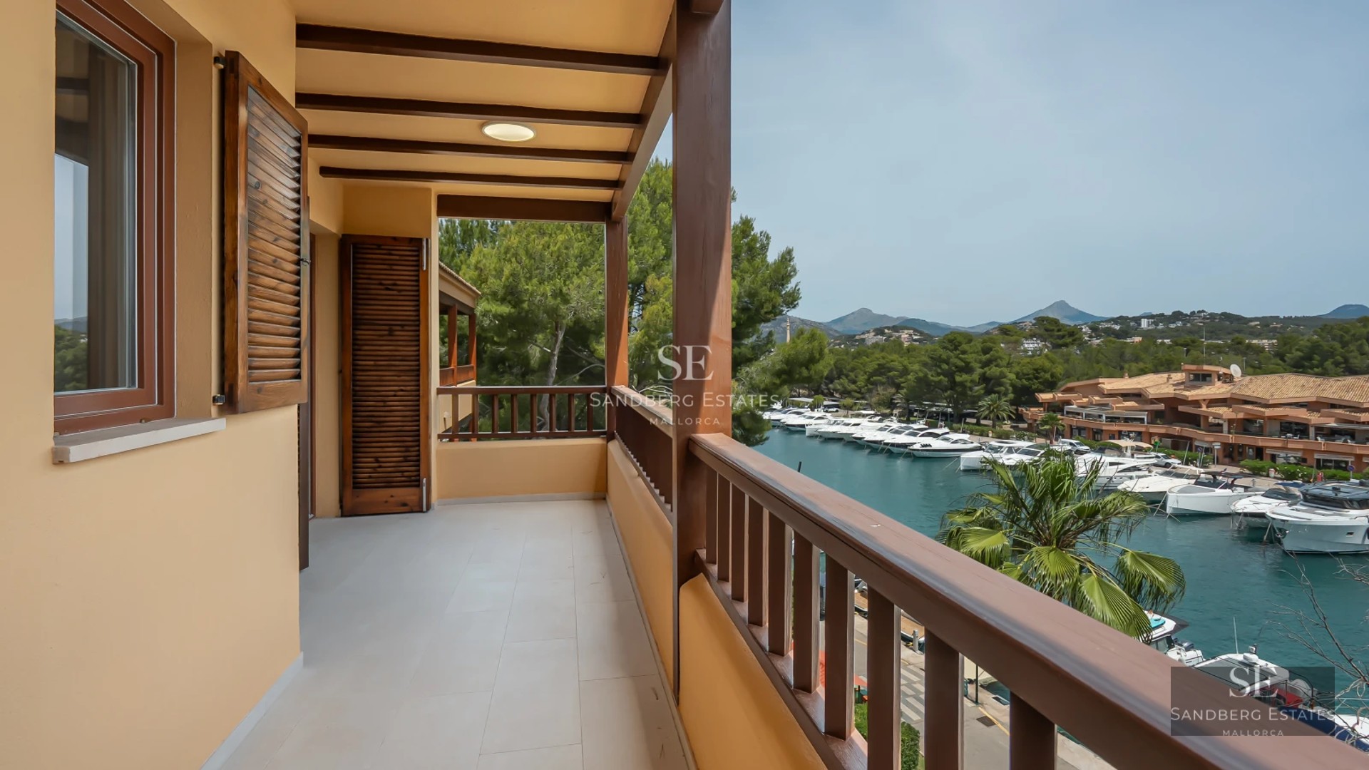 Exterior of a modern home with a pool, terrace, and large windows. Sleek design with high-quality finishes.