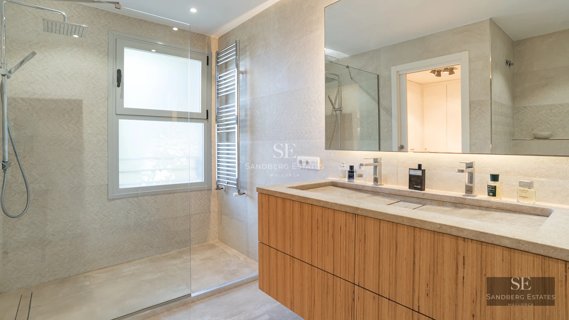 Spacious balcony with sea view. Modern, elegant furniture with glass railing. Ideal for relaxing and enjoying the view.