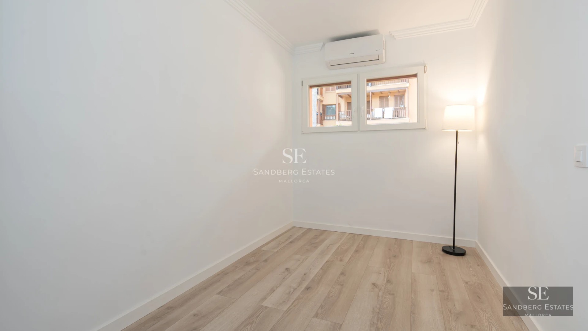 Exterior view of a modern villa with a pool, spacious terrace, lush greenery, and minimalist architectural design.