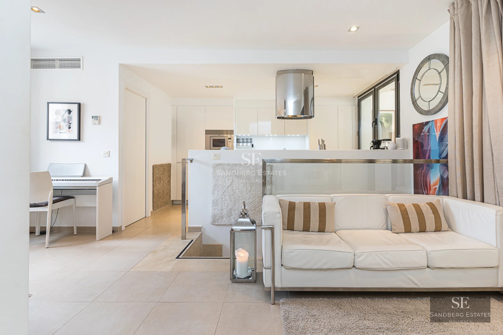 Expansive pool terrace surrounded by gardens. Modern architecture with large windows and luxury finishes.