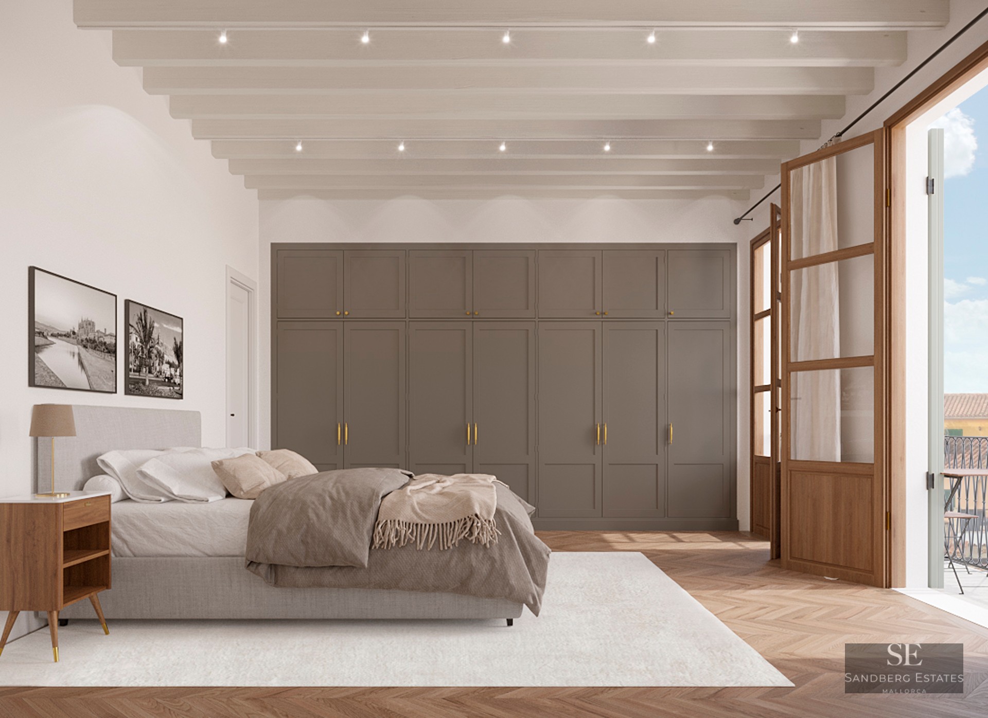Spacious master bedroom featuring wooden ceiling beams, built-in wardrobes, and herringbone floors with balcony access.