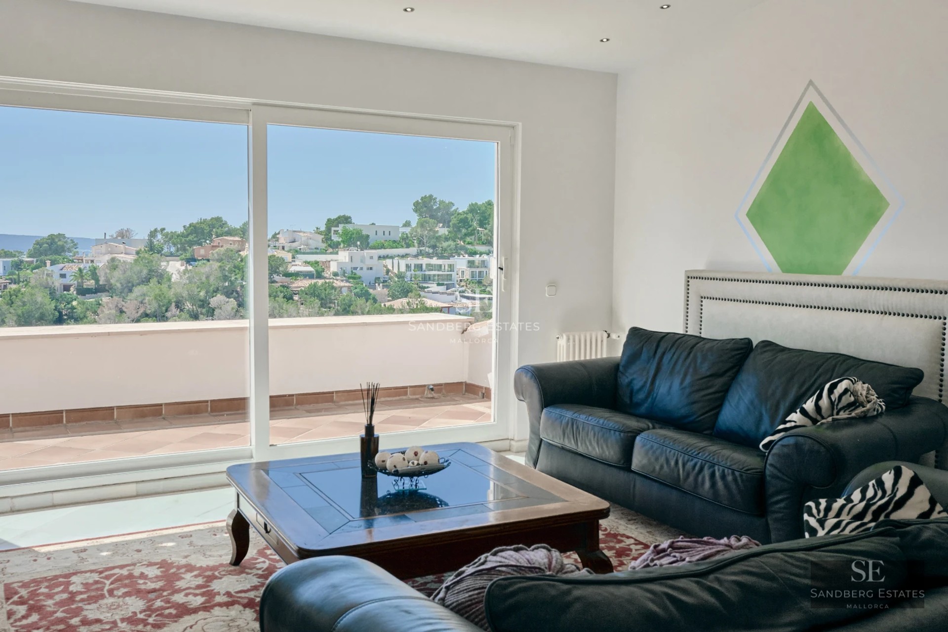 Spacious balcony with panoramic sea views. Modern and elegant furniture. Wood flooring. Glass balustrade.