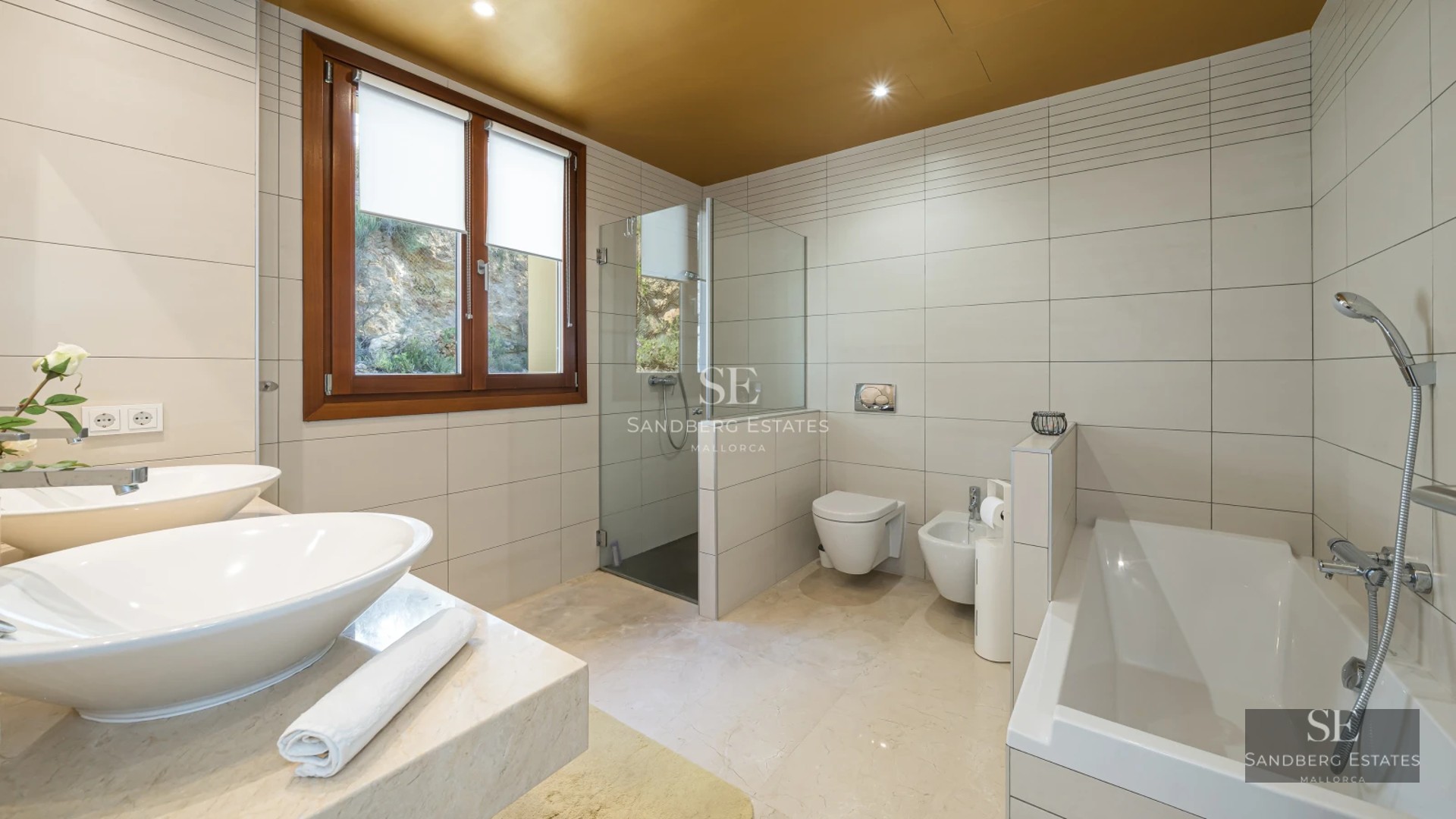 Spacious balcony with sea view. Light wood floors and modern furniture. Glass railing for unobstructed panoramic view.