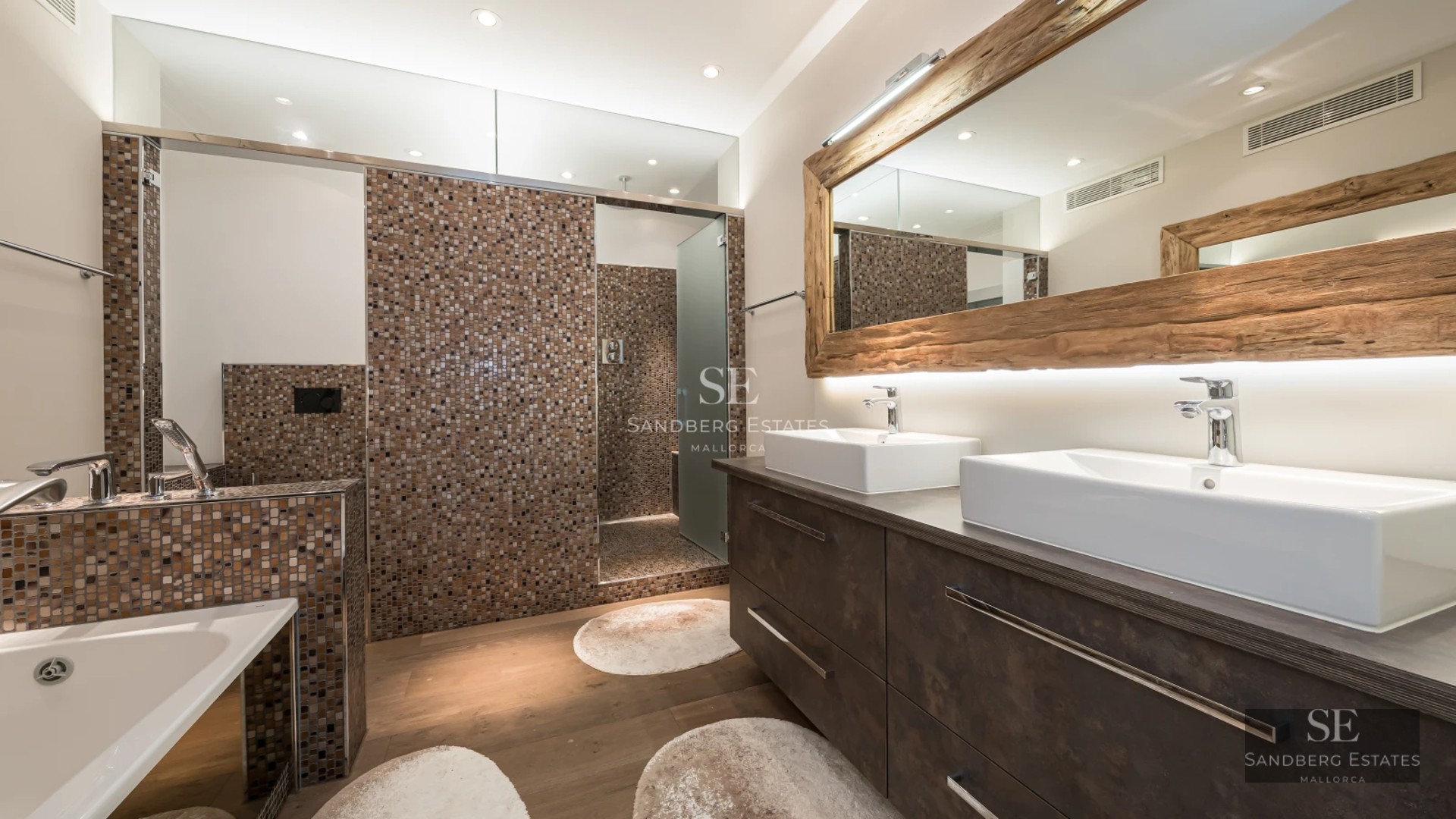 Spacious living room with panoramic windows, modern sofas, stylish rug and stunning ocean views. Bright, minimalist design.