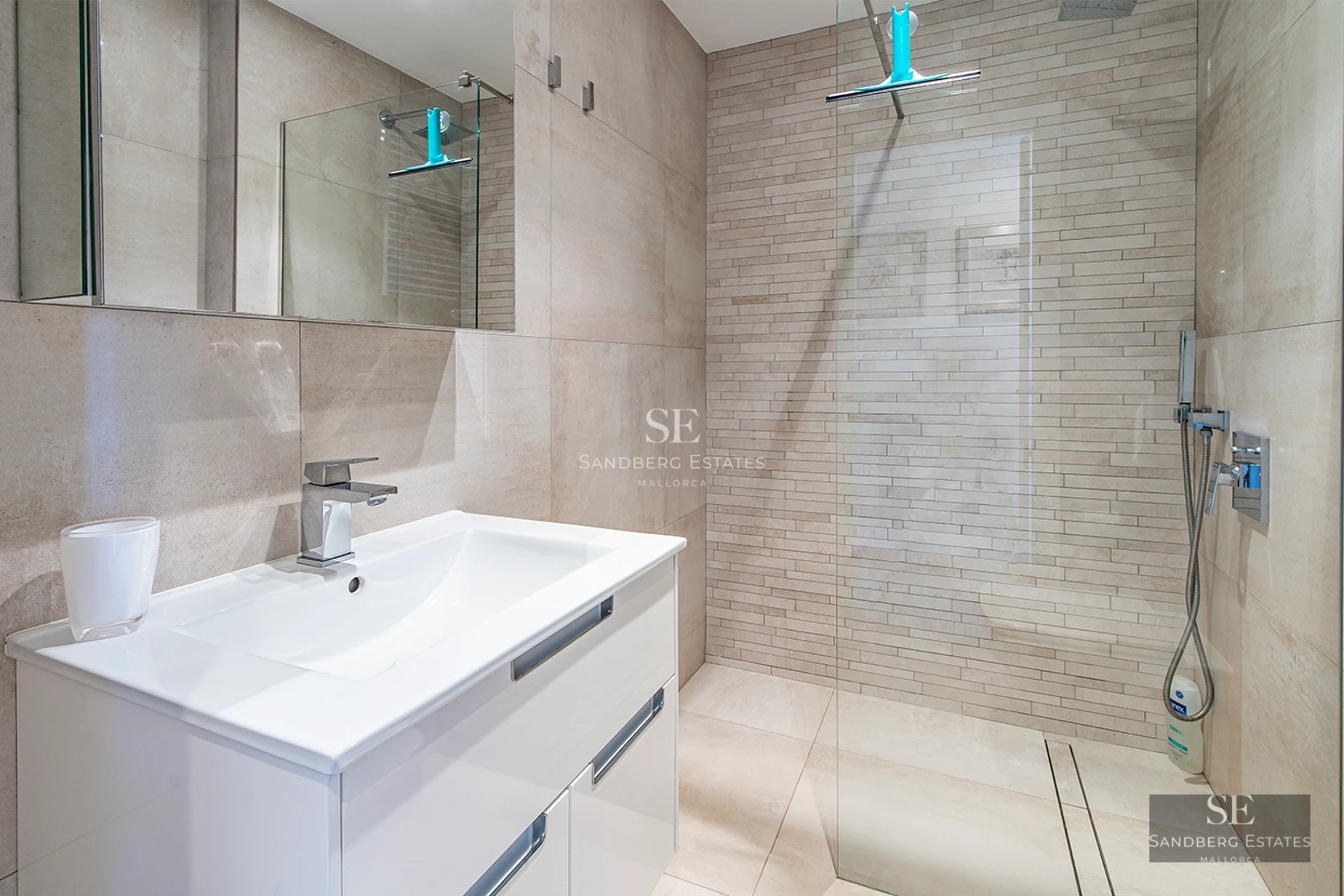 Modern villa exterior with infinity pool. Minimalist design, large windows, and lush gardens. Soft ambient lighting.