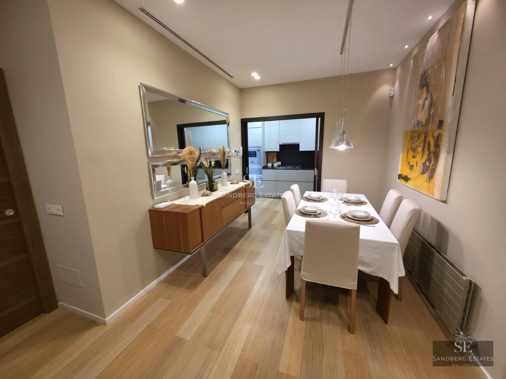 Aerial view of a modern villa with a turquoise pool and lush garden. Minimalist architecture, clean lines, and luxury finishes.