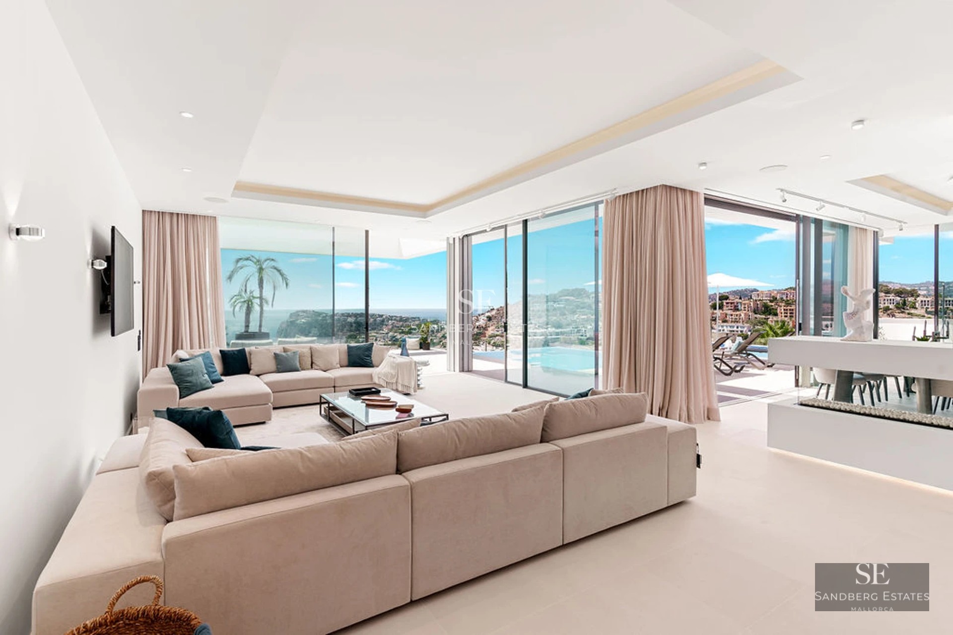 Spacious terrace featuring an infinity pool and panoramic views. Modern design, elegant outdoor furniture. Lush vegetation.