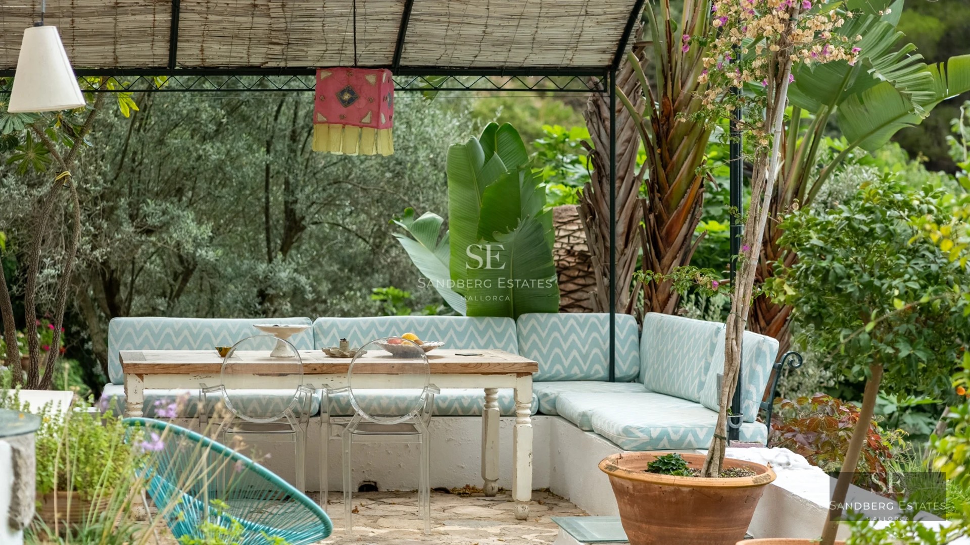 Panoramic view of a modern villa featuring an infinity pool, spacious terrace, and minimalist architecture. Sleek design and abundant natural light.