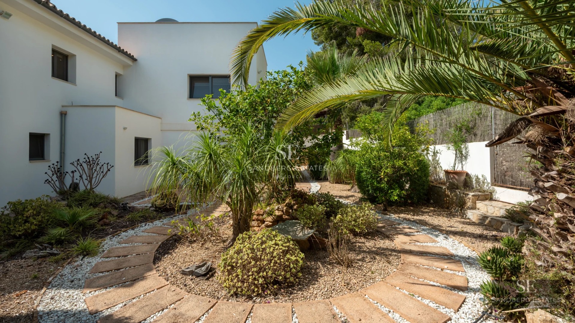 View of modern villa with infinity pool. Minimalist design, large terraces, and panoramic views. Warm lighting and serene environment.