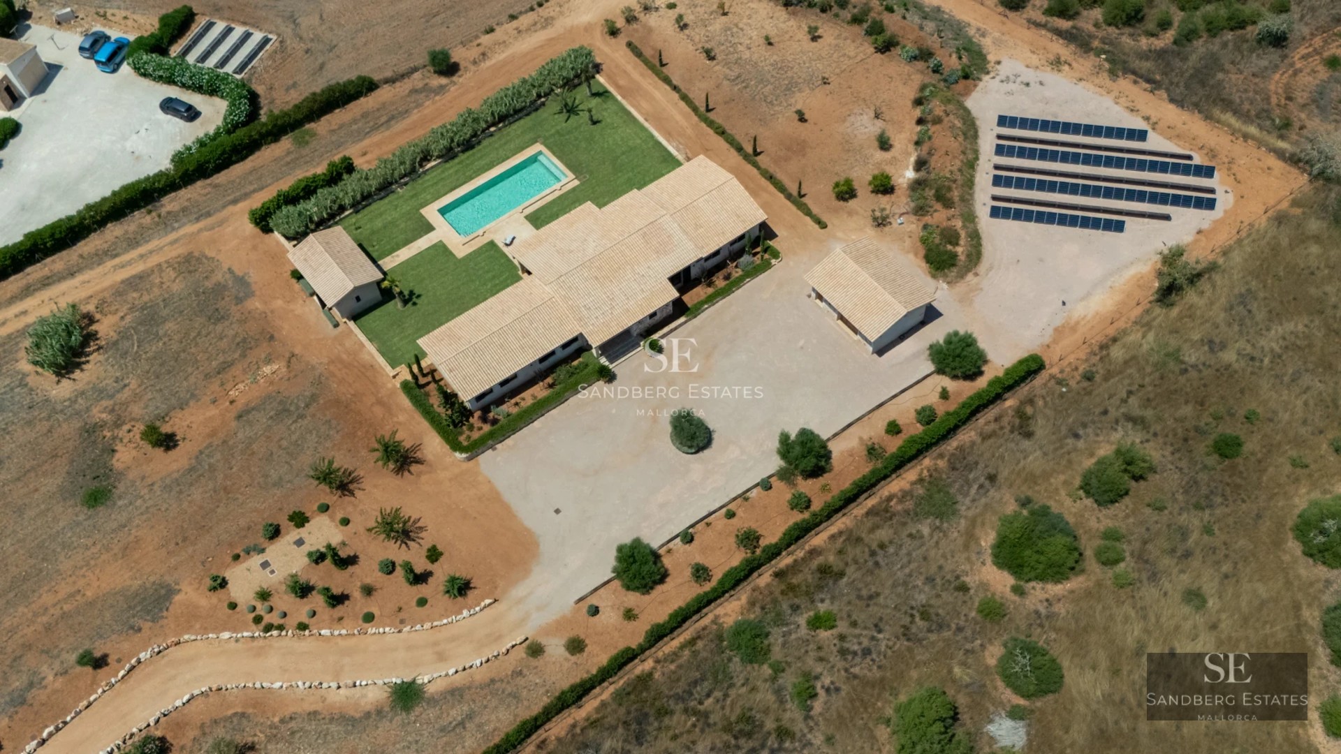 Aerial view of modern villa with pool, garden and large terraces. Elegant architecture and high-quality finishes.