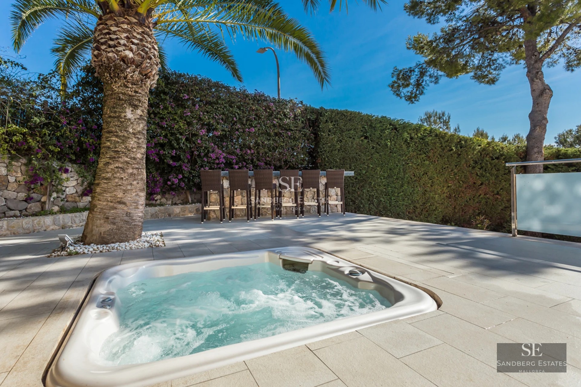 Spacious terrace with infinity pool, sun loungers, and panoramic views. Modern architecture, clean lines, and abundant natural light.