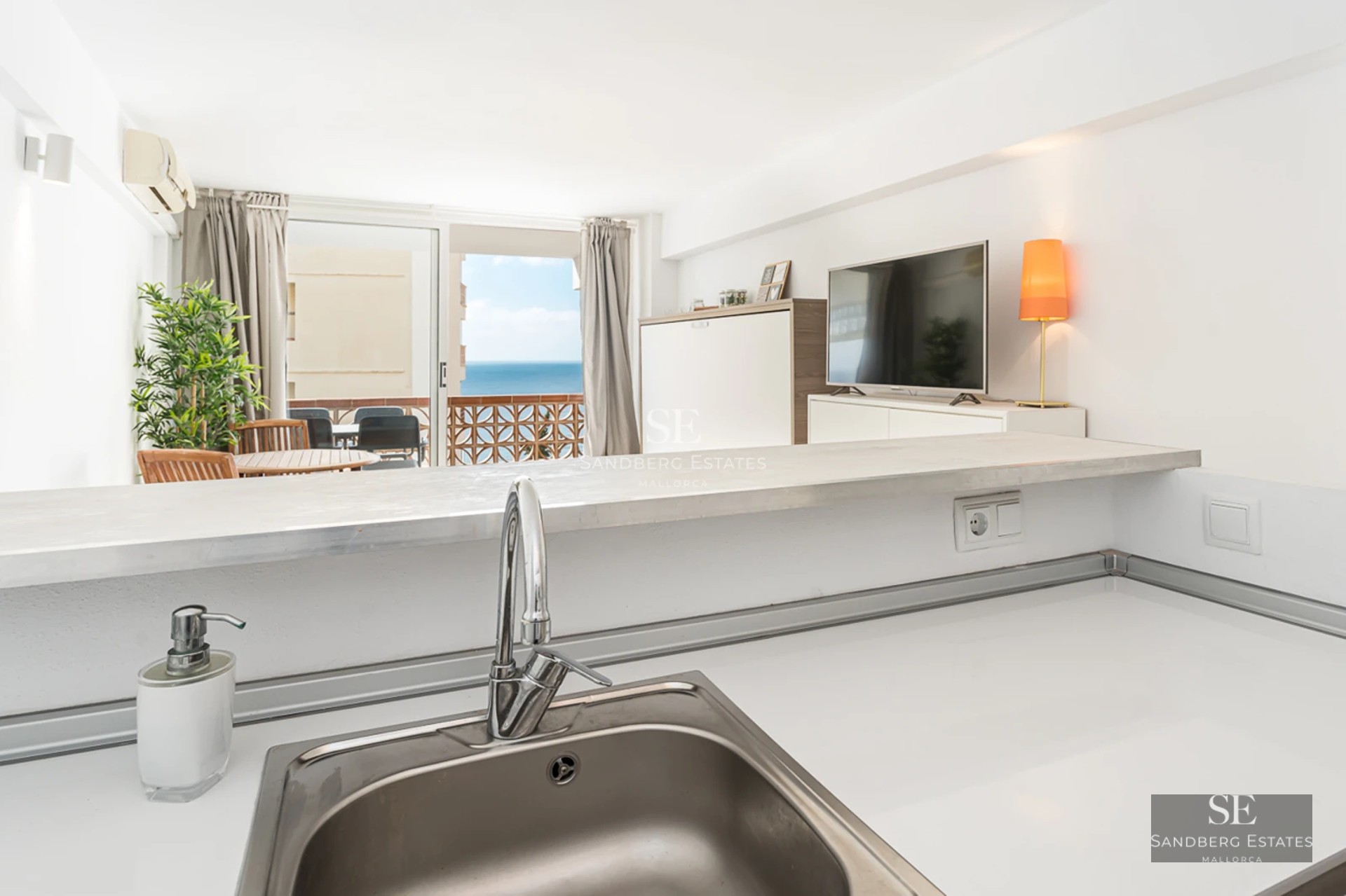 Spacious terrace with pool, sun loungers, and garden view. Modern architecture with large windows and minimalist design.