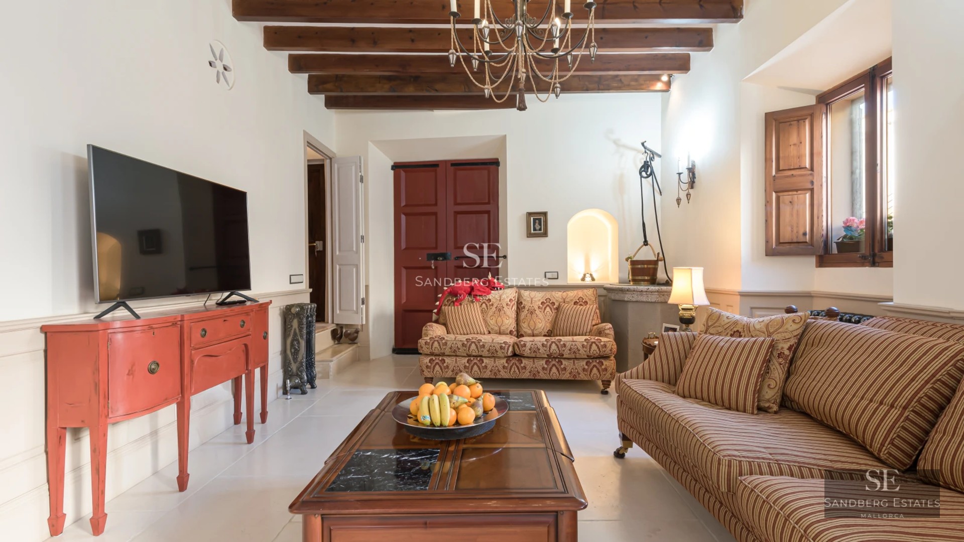 Exterior view of a modern villa with a swimming pool, wooden deck, manicured lawn, and minimalist white facade. Warm ambient lighting.