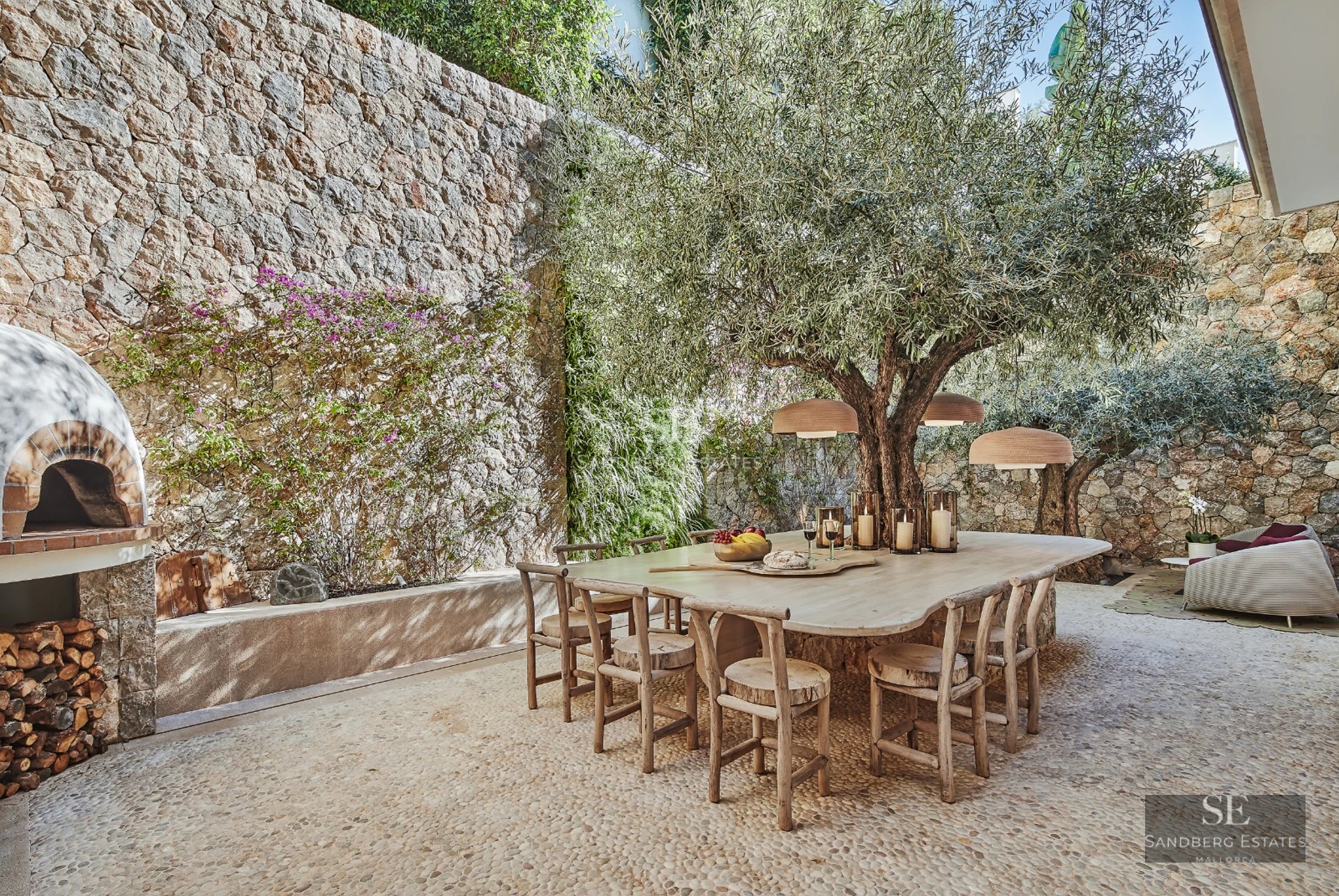 Exterior view of a modern villa featuring an infinity pool, spacious terraces, and minimalist architecture. White facade with large windows.