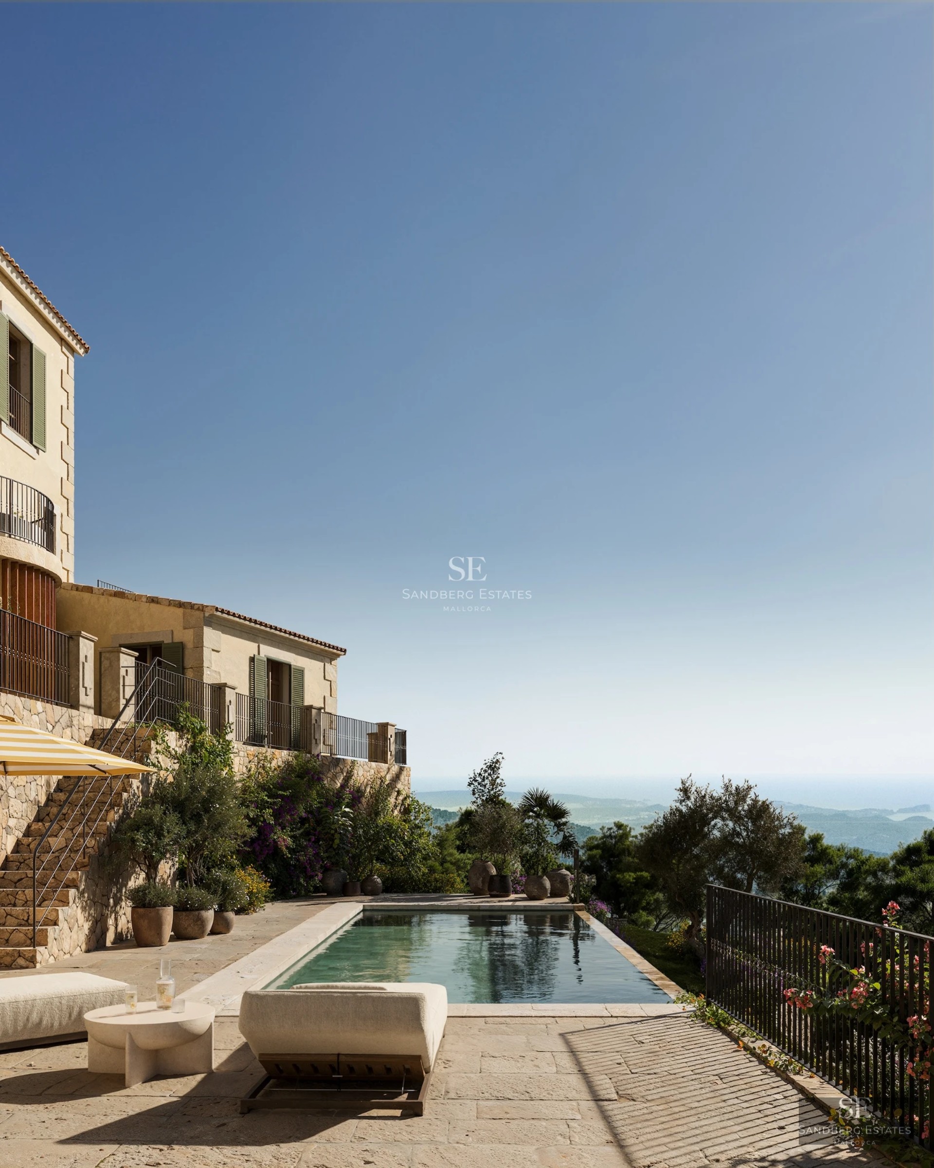 Panoramic view of a modern living room with a spacious balcony, pool, and sea in the background. Minimalist design, abundant natural light.