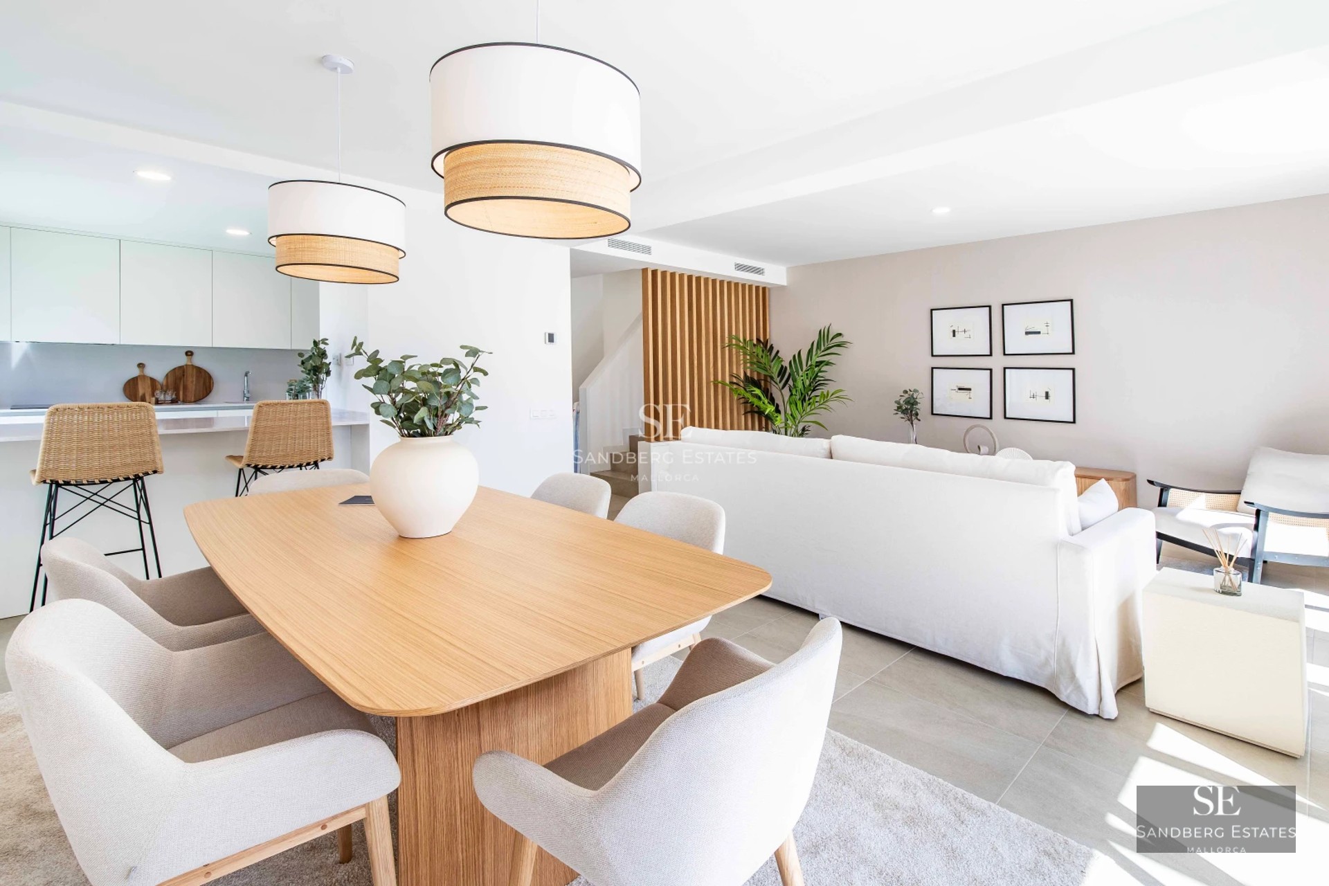 Property view showcasing an infinity pool and lush garden. Modern architecture and sleek design with ambient lighting.