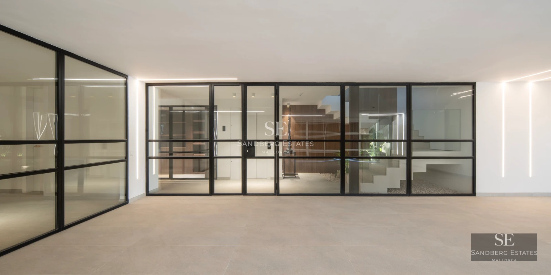 Exterior view of a modern villa featuring an infinity pool, large windows, and lush garden. Minimalist architecture and elegant landscaping.