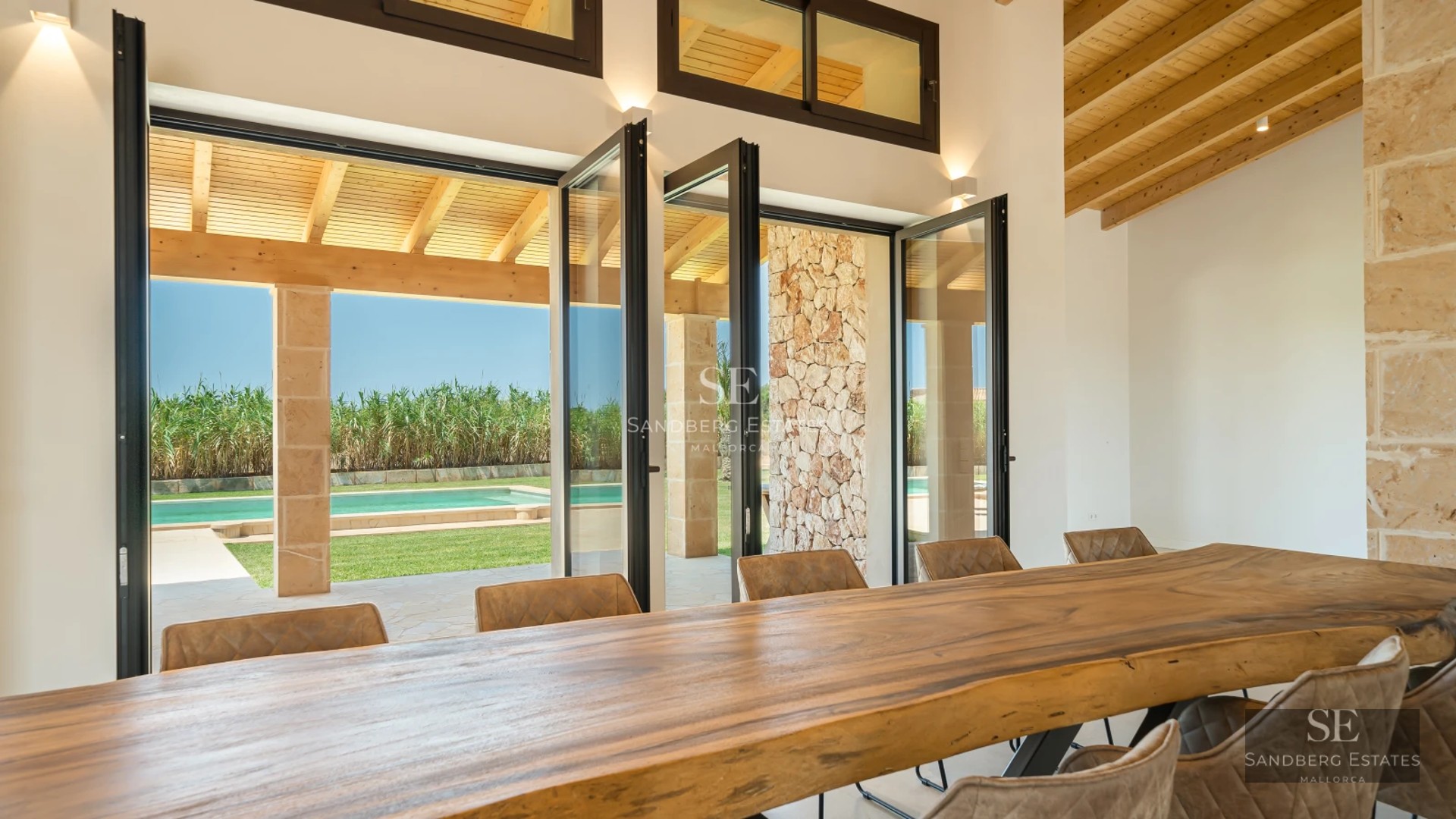 Spacious terrace with pool, sun loungers, and views. Modern architecture with clean lines and large windows. Luxury design.