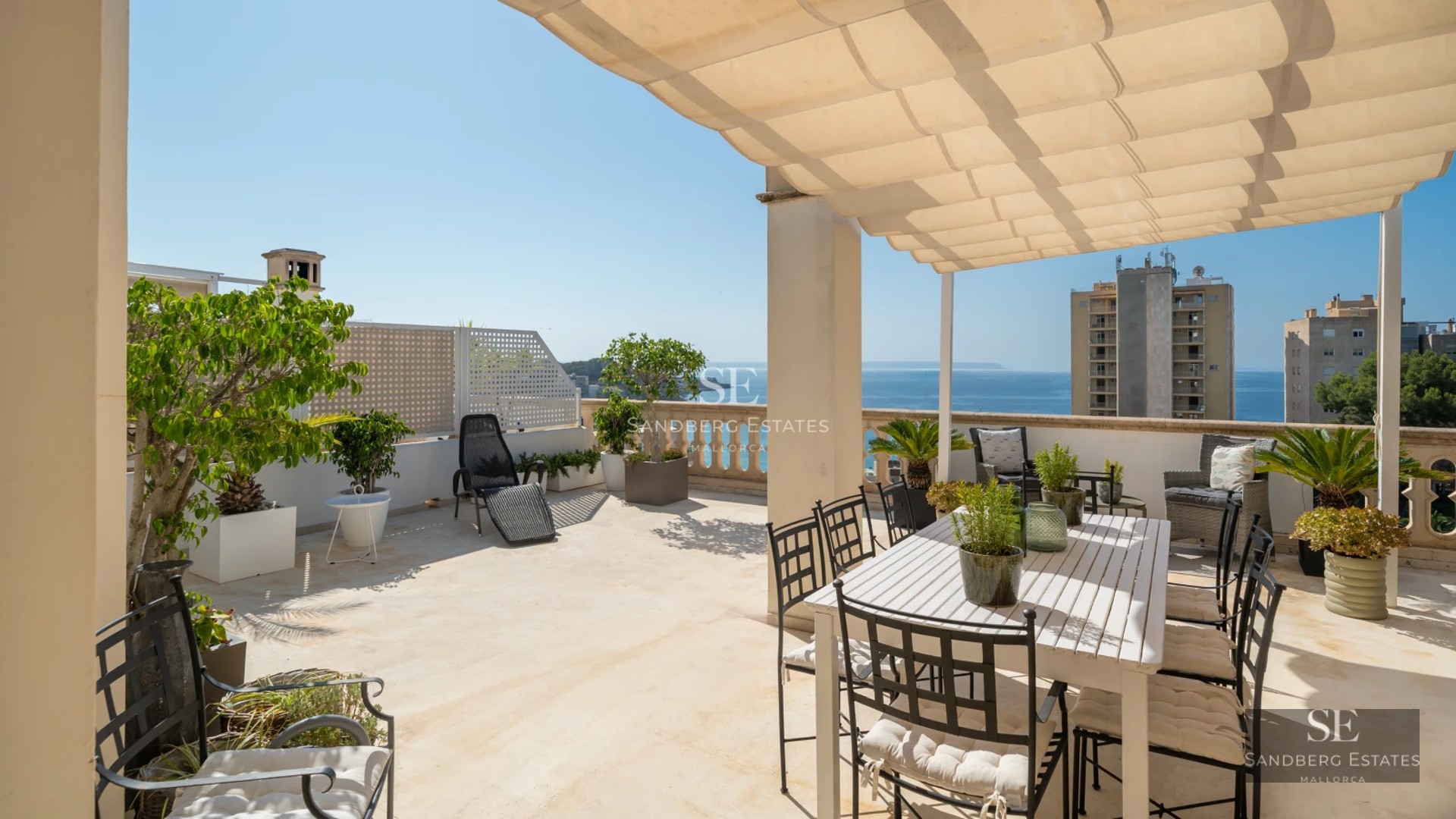 Modern villa with infinity pool, stylish sun loungers, lush garden, and panoramic views. Contemporary architectural design.